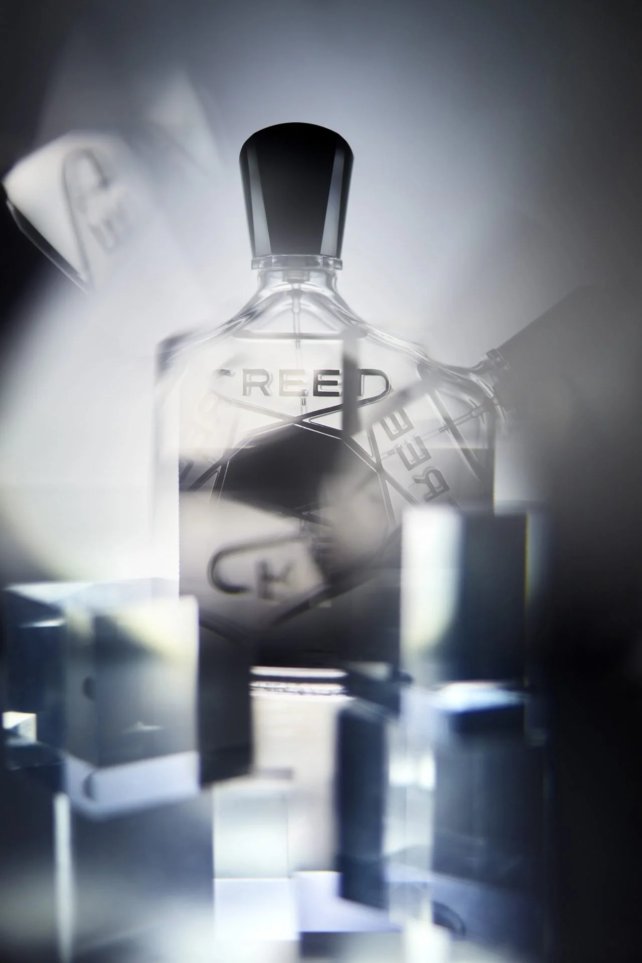 A close-up of an electronic device with the word 'REED' on it, surrounded by metallic and glass components with a futuristic, high-tech appearance.