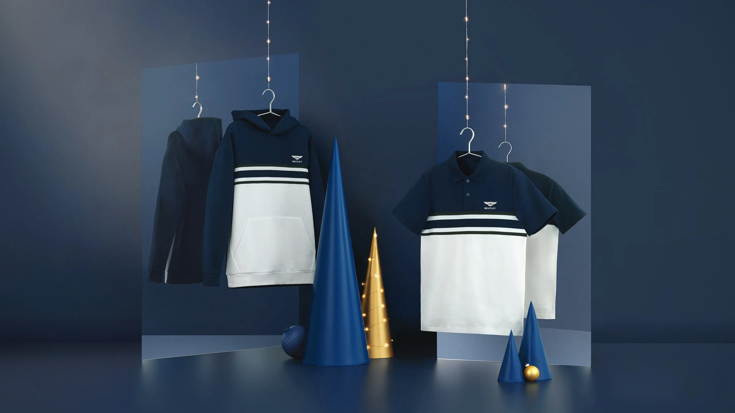 Blue and white clothing items with Bentley logo hanging on hangers, surrounded by decorative cones and ornaments on a blue background.