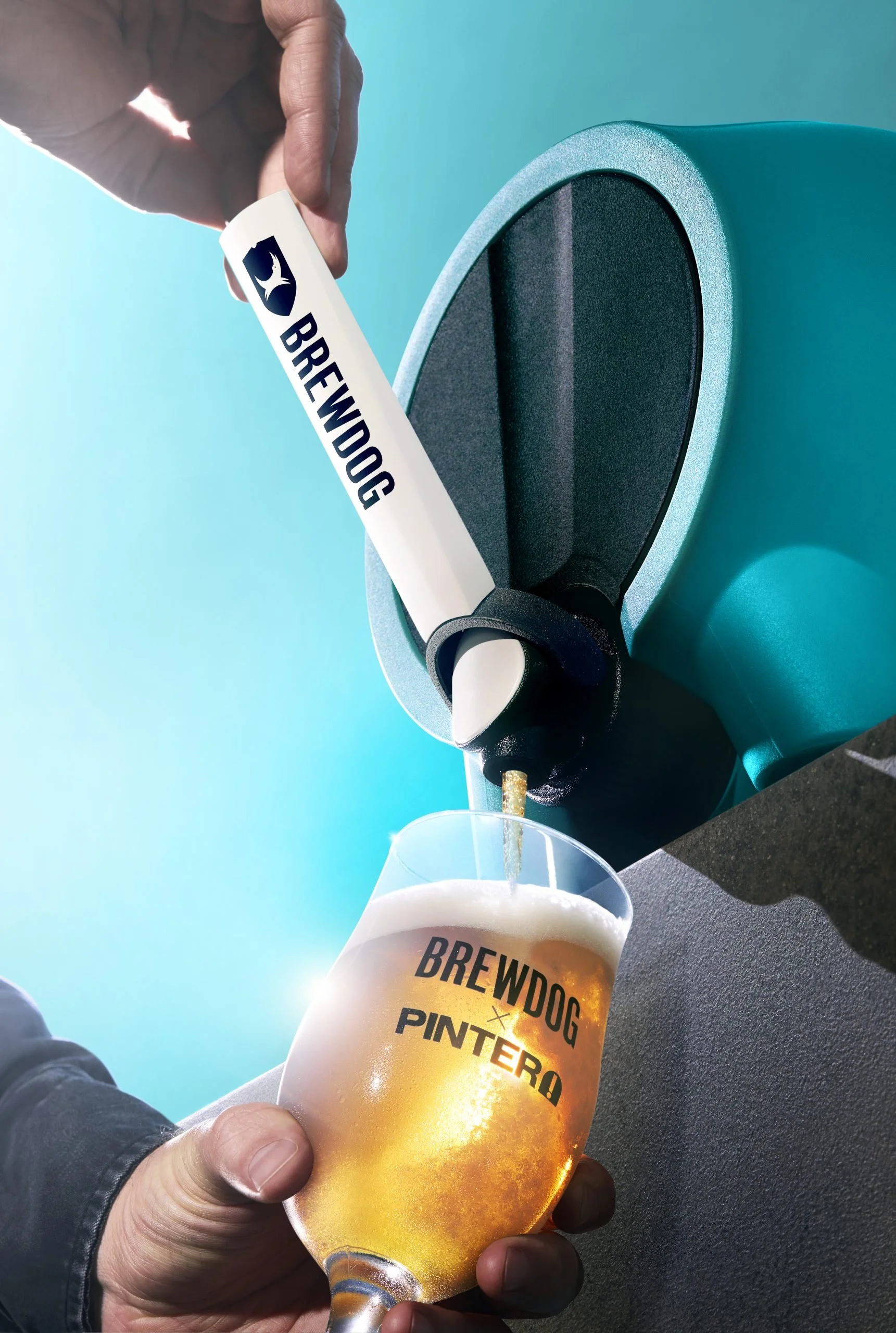 Person holding a plastic cup of beer with the Brewdog Pintera logo, pouring beer from a blue tap labeled Brewdog, against a blue background.