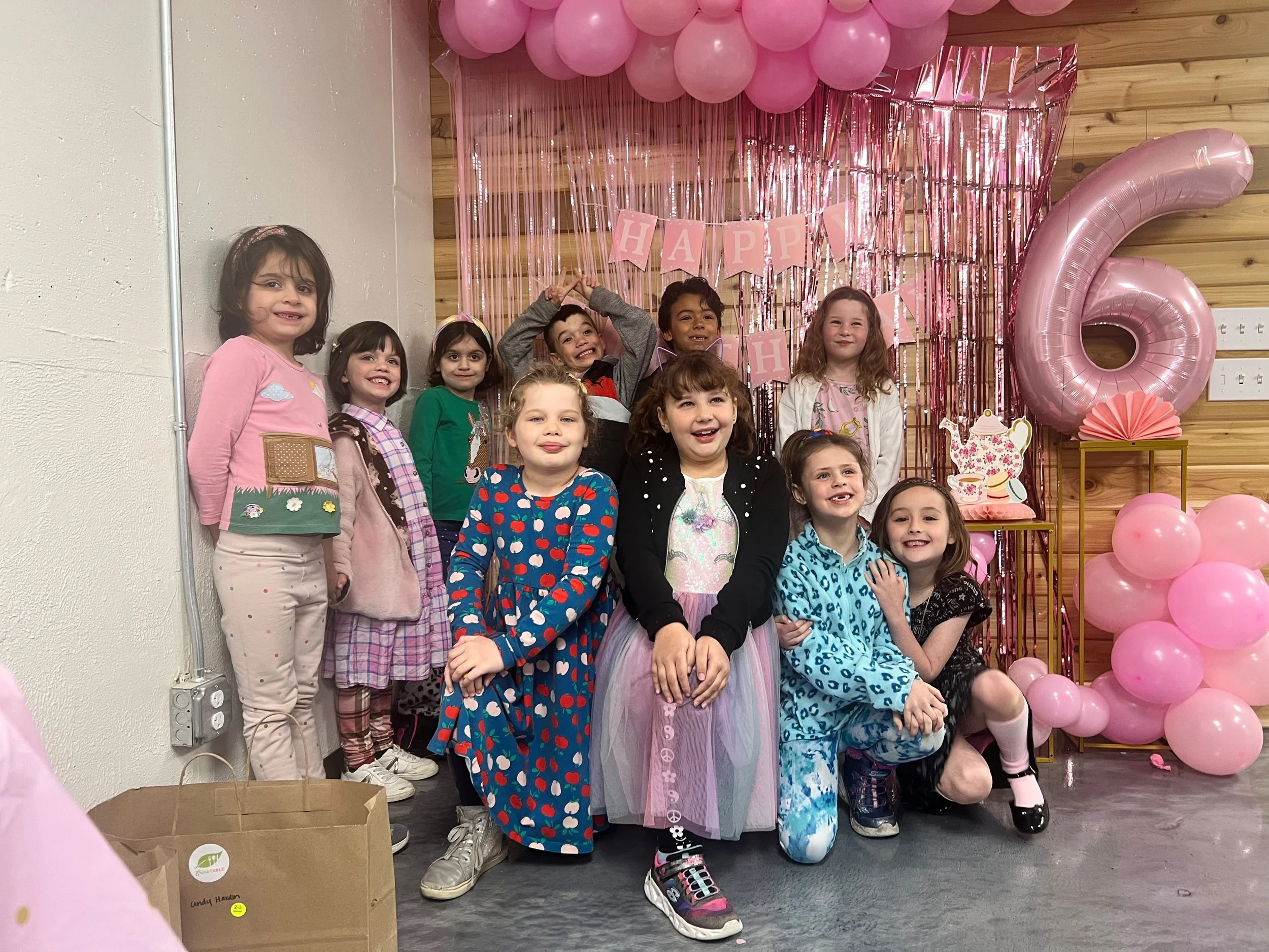 Children celebrating a birthday party at Made By You.