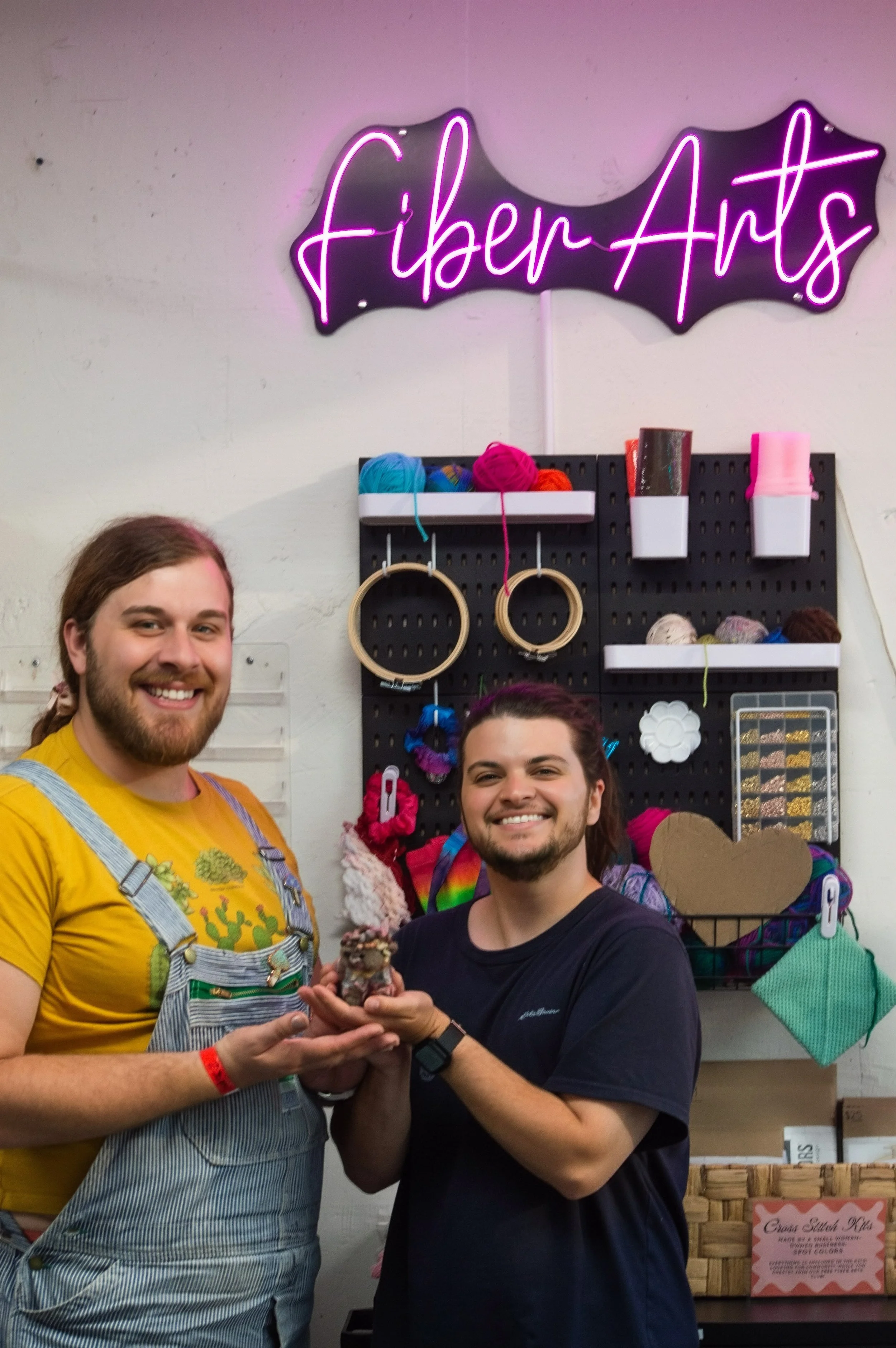 Friends posing together during a creative studio visit.