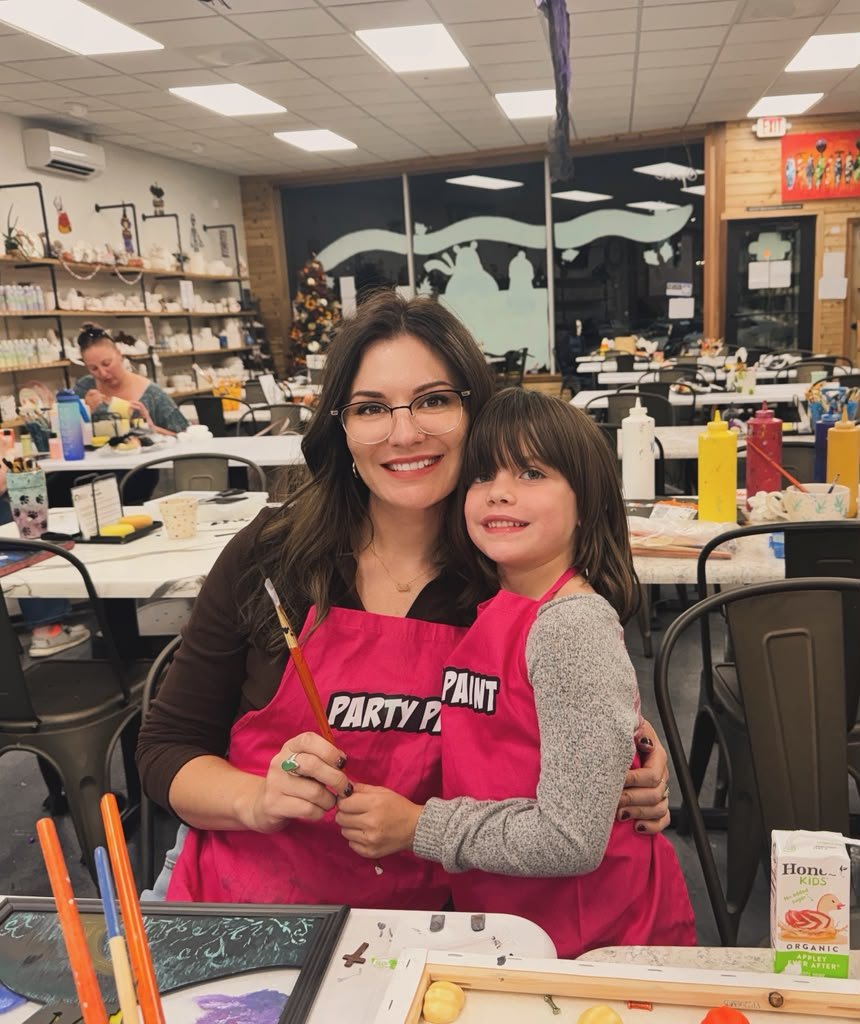 A parent and child enjoying a creative activity at Made By You.