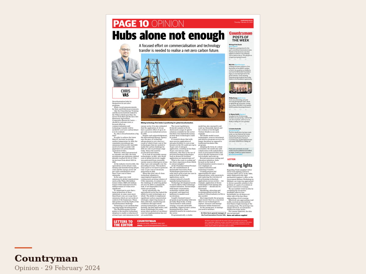 An opinion editorial by Dr Chris Vas with the headline "Hubs alone not enough". The page features a photo of a person in a suit with arms crossed, and a large image of mining equipment. The article discusses decarbonisation and technology transfer.
