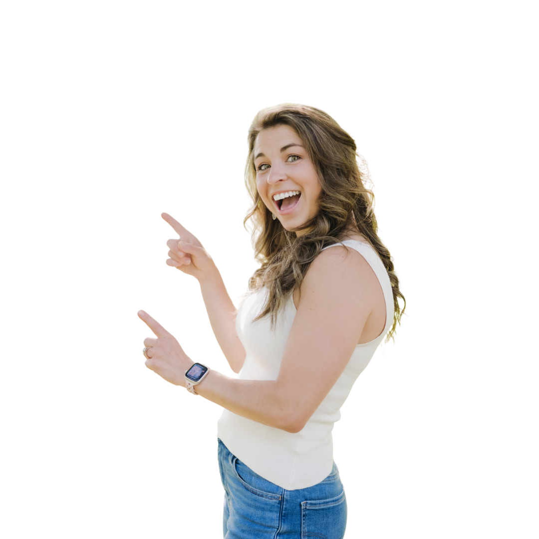 A registered dietitian and owner of pivot nutrition coaching wearing a white sleeveless top and blue jeans, smiling and pointing to her left with both hands.