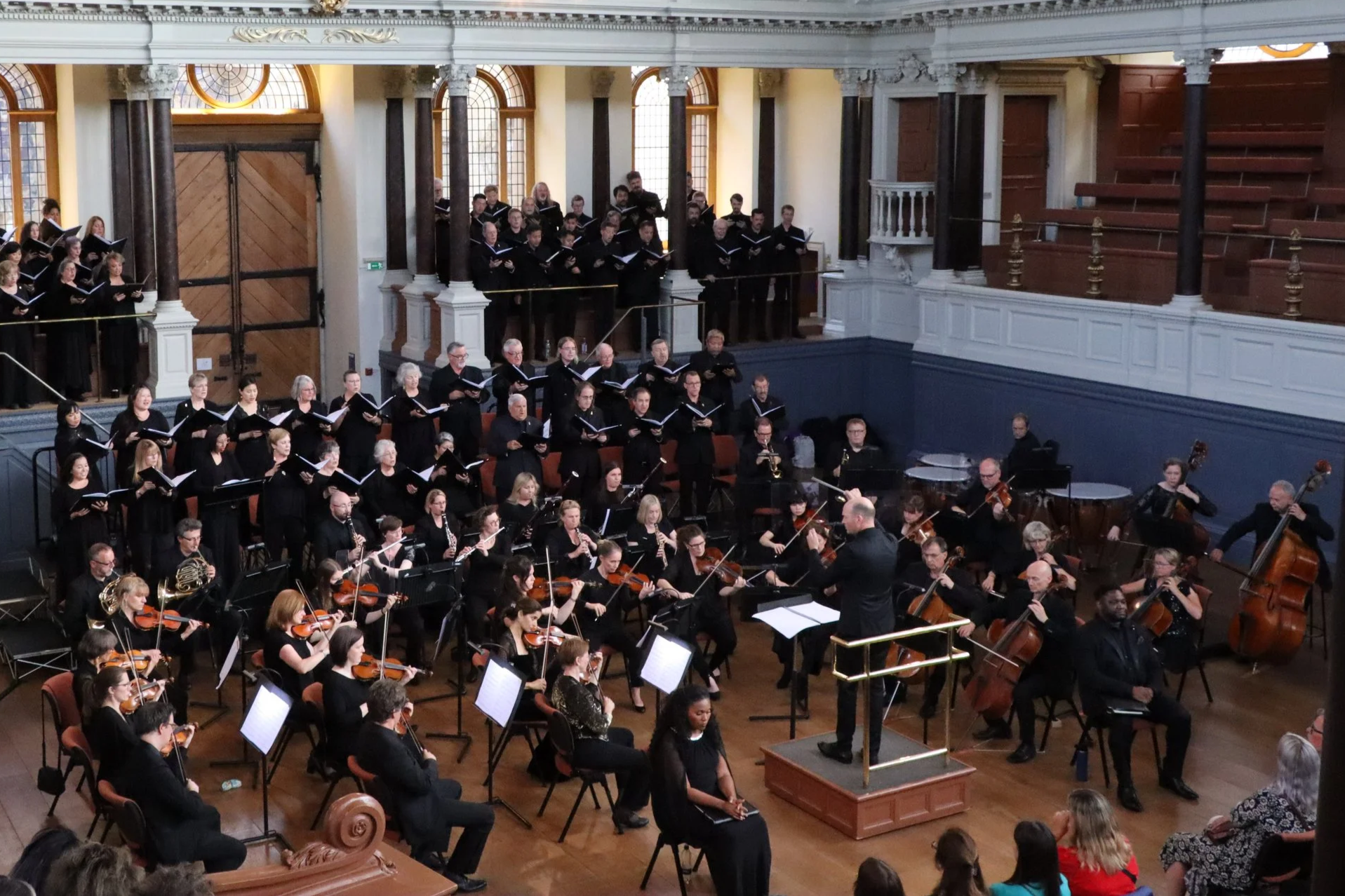 Bath Philharmonic Orchestra perform with the choir Pacific Choral at the Sheldonian Theatre in Oxford.