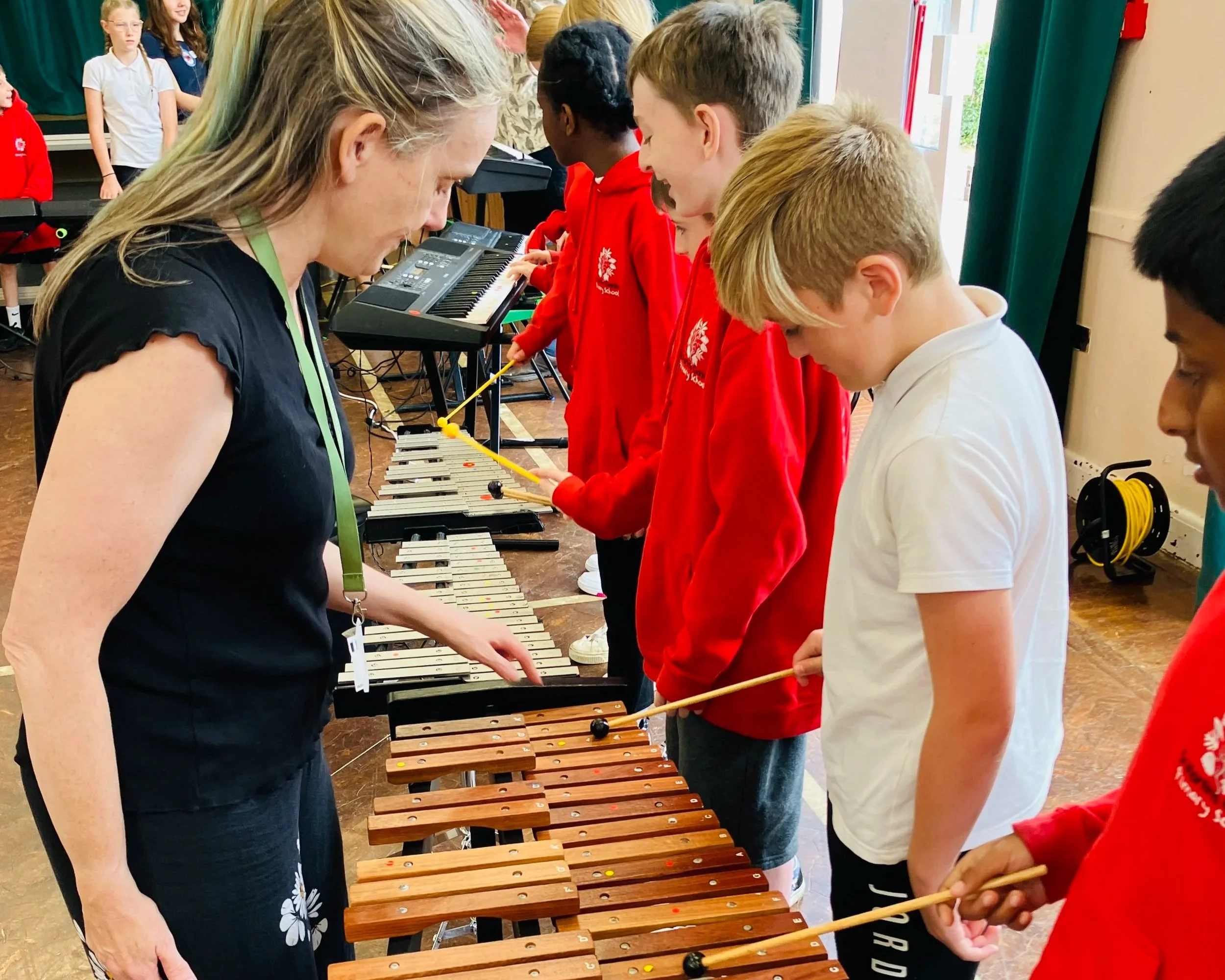 Music Leader from Bath Philharmonic Orchestra teaches primary school students the xylophone and glockenspiel.