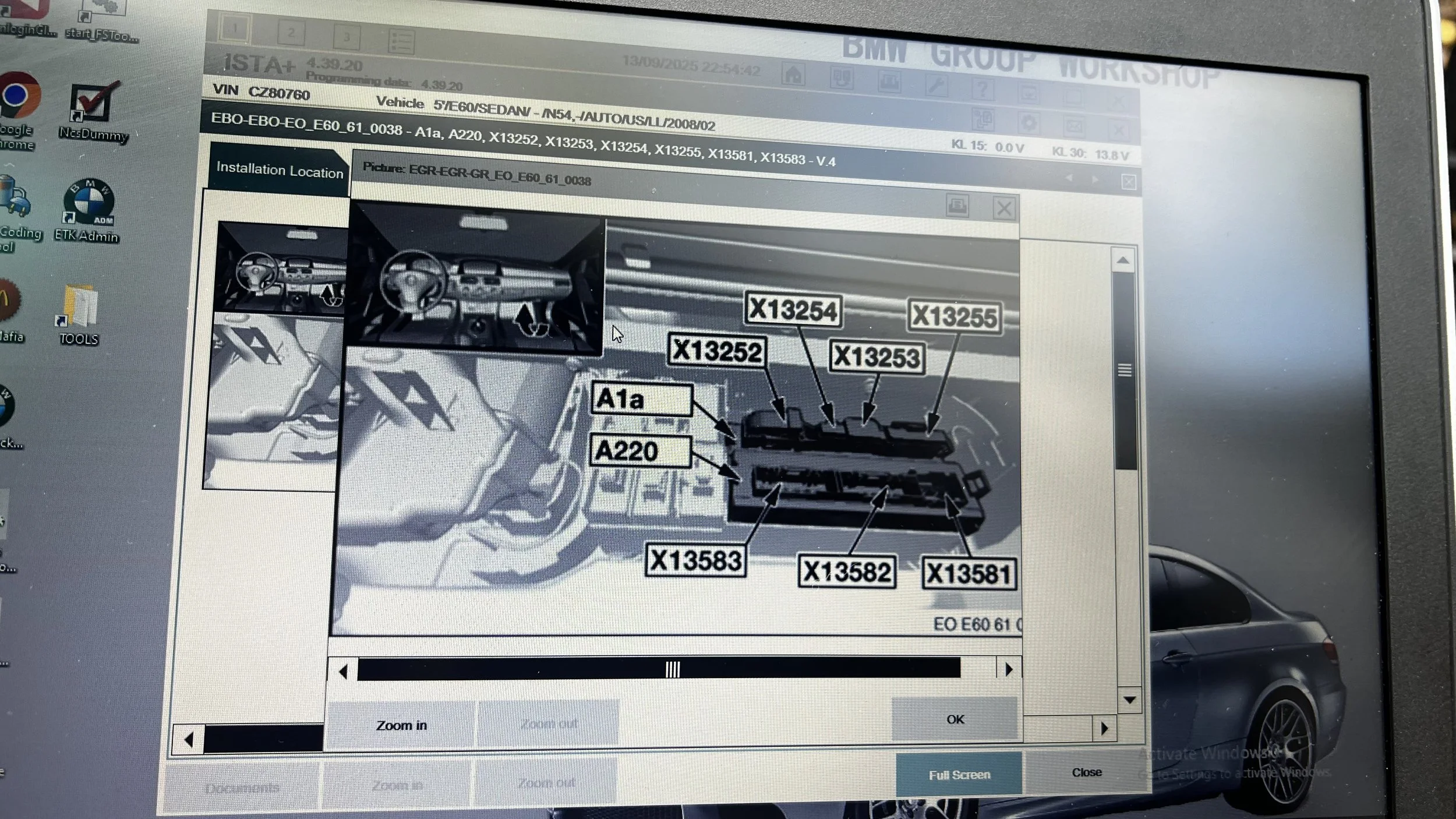 Computer screen displaying a diagnostic interface for a vehicle, with images of a vehicle's interior and dash, and labels with codes such as X13254, X13255, and A1a.
