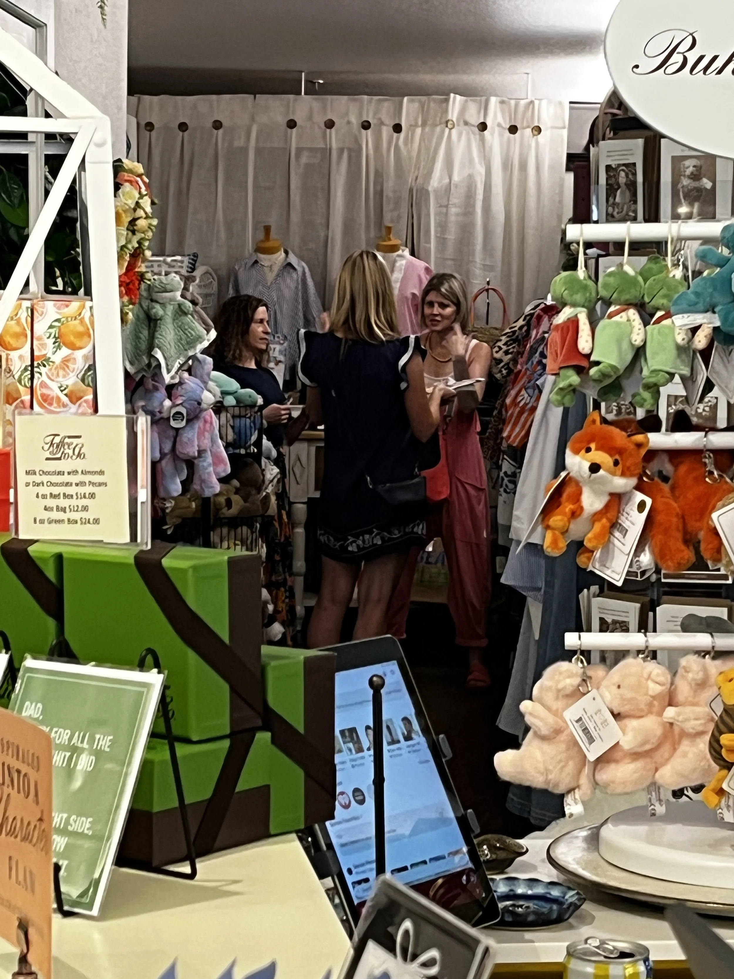 Attendees enjoying a luxury storytelling and shopping experience during Sip & Sign.