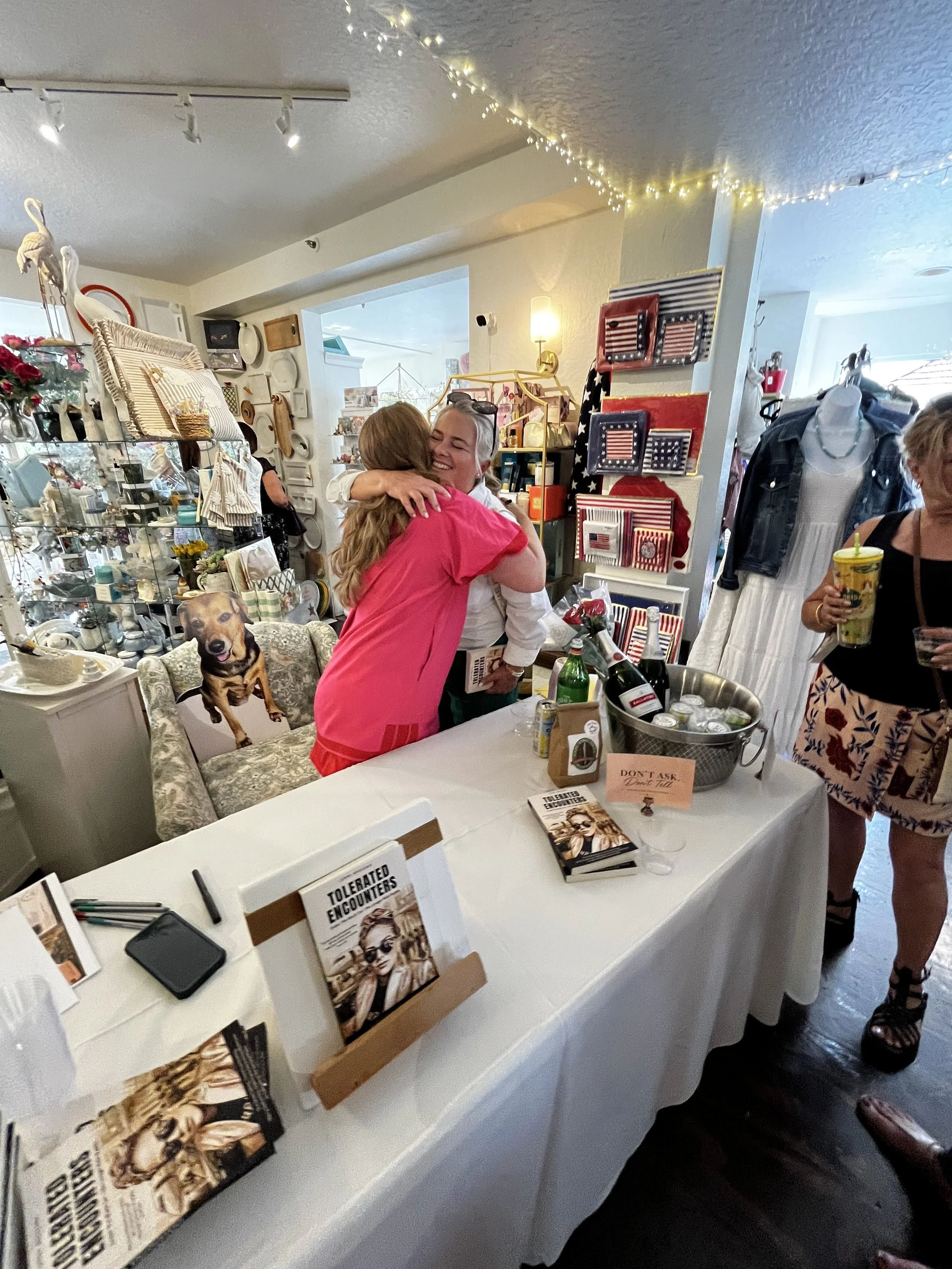 Attendees enjoying a luxury storytelling and shopping experience during Sip & Sign.