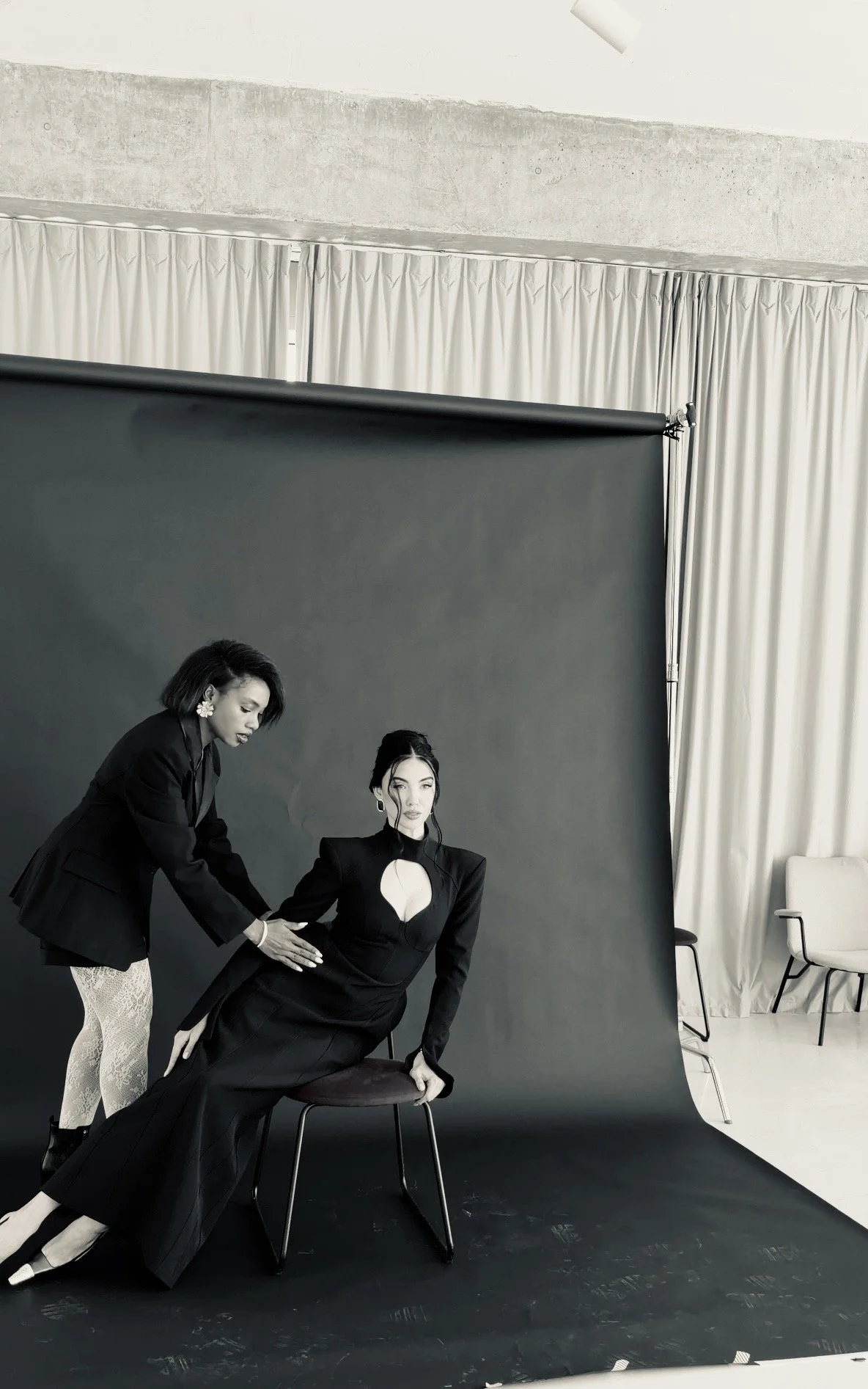 Luxury Dubai fashion stylist, working on set during a photoshoot styling session with her client
