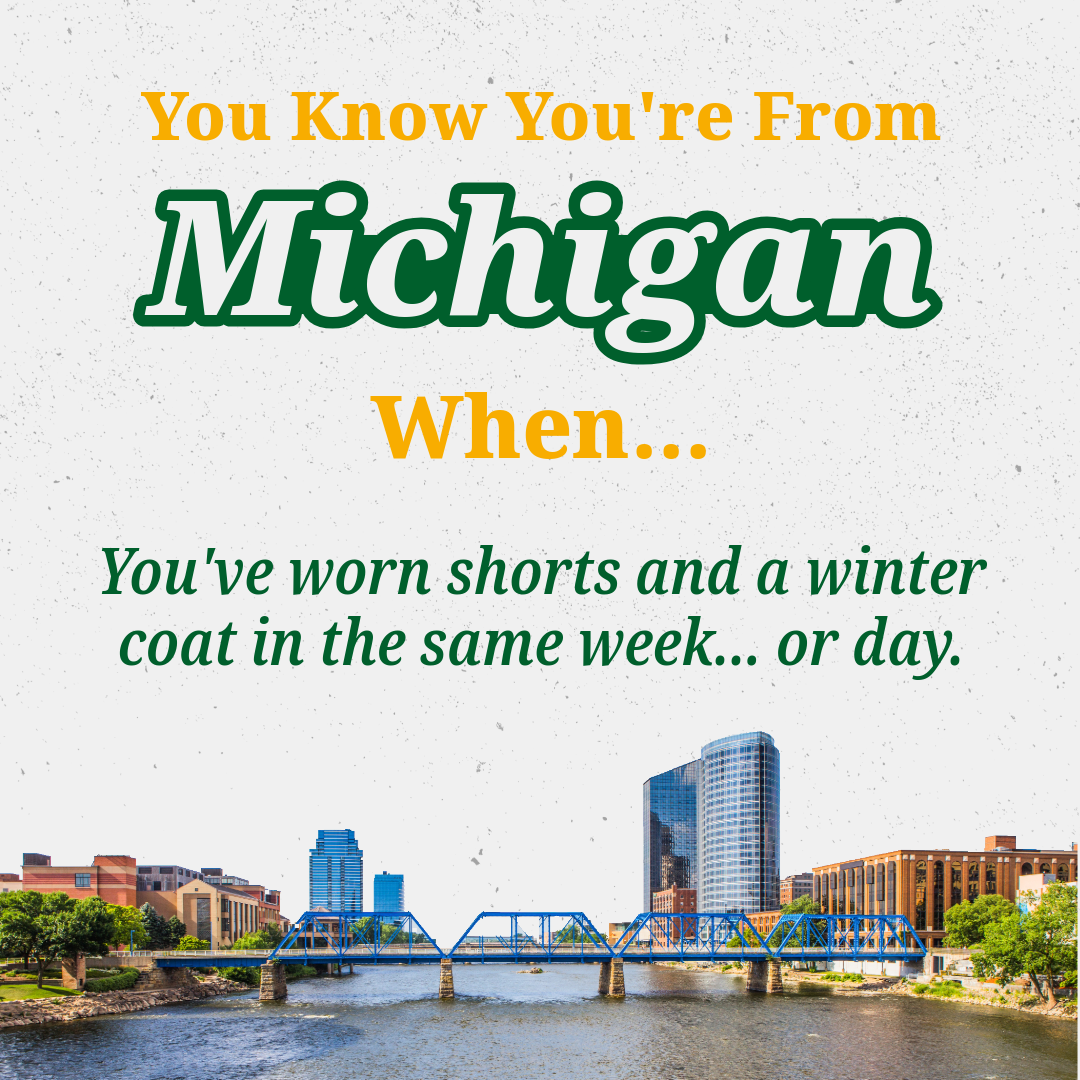 Text on a graphic that says, 'You Know You're From Michigan When... You've worn shorts and a winter coat in the same week... or day.' There is a river with a blue bridge and a city skyline with tall buildings in the background.