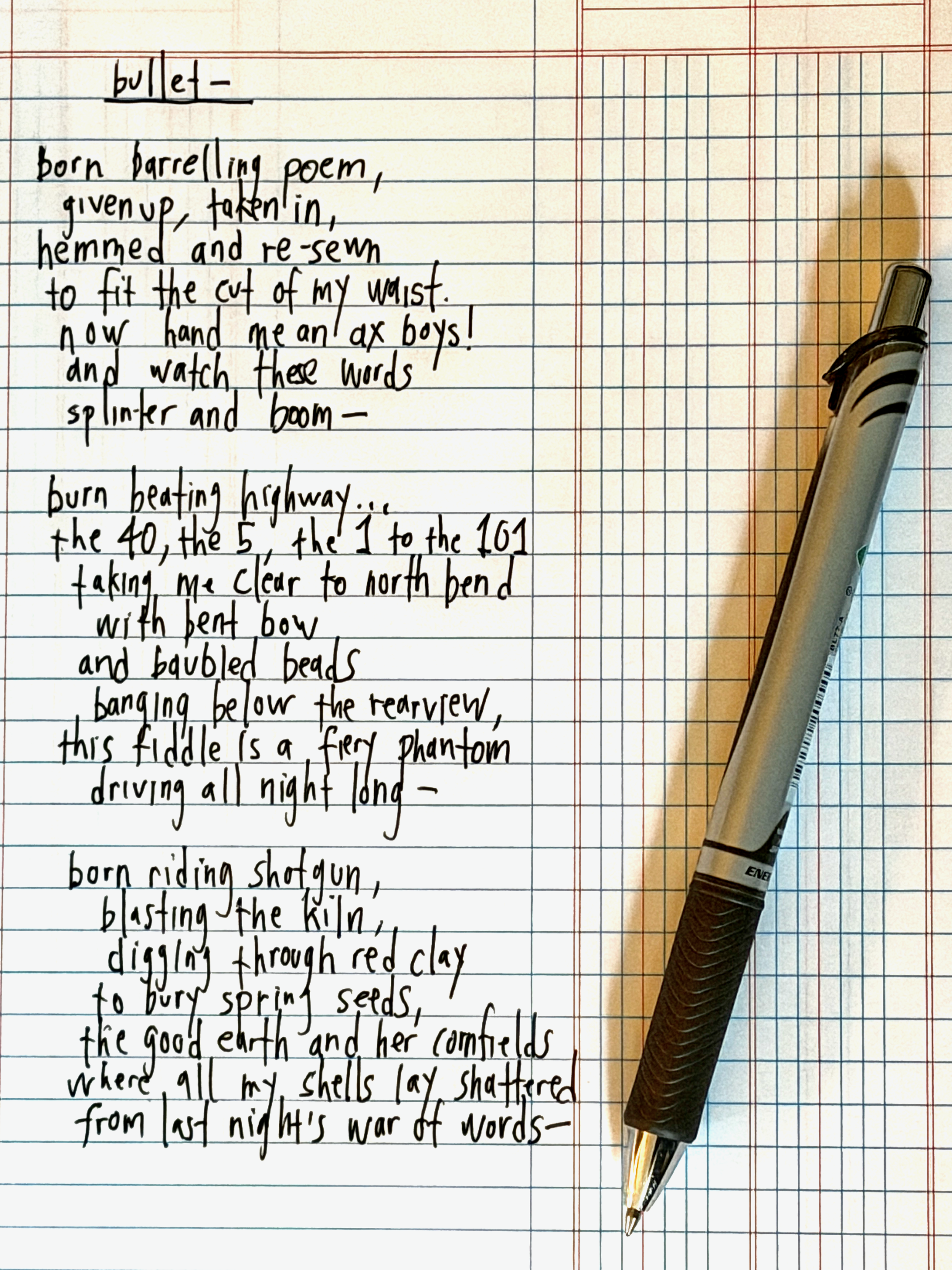 Close-up of handwritten poem by C.S. Harvey on lined notebook paper with a black and silver pen resting on the page.
