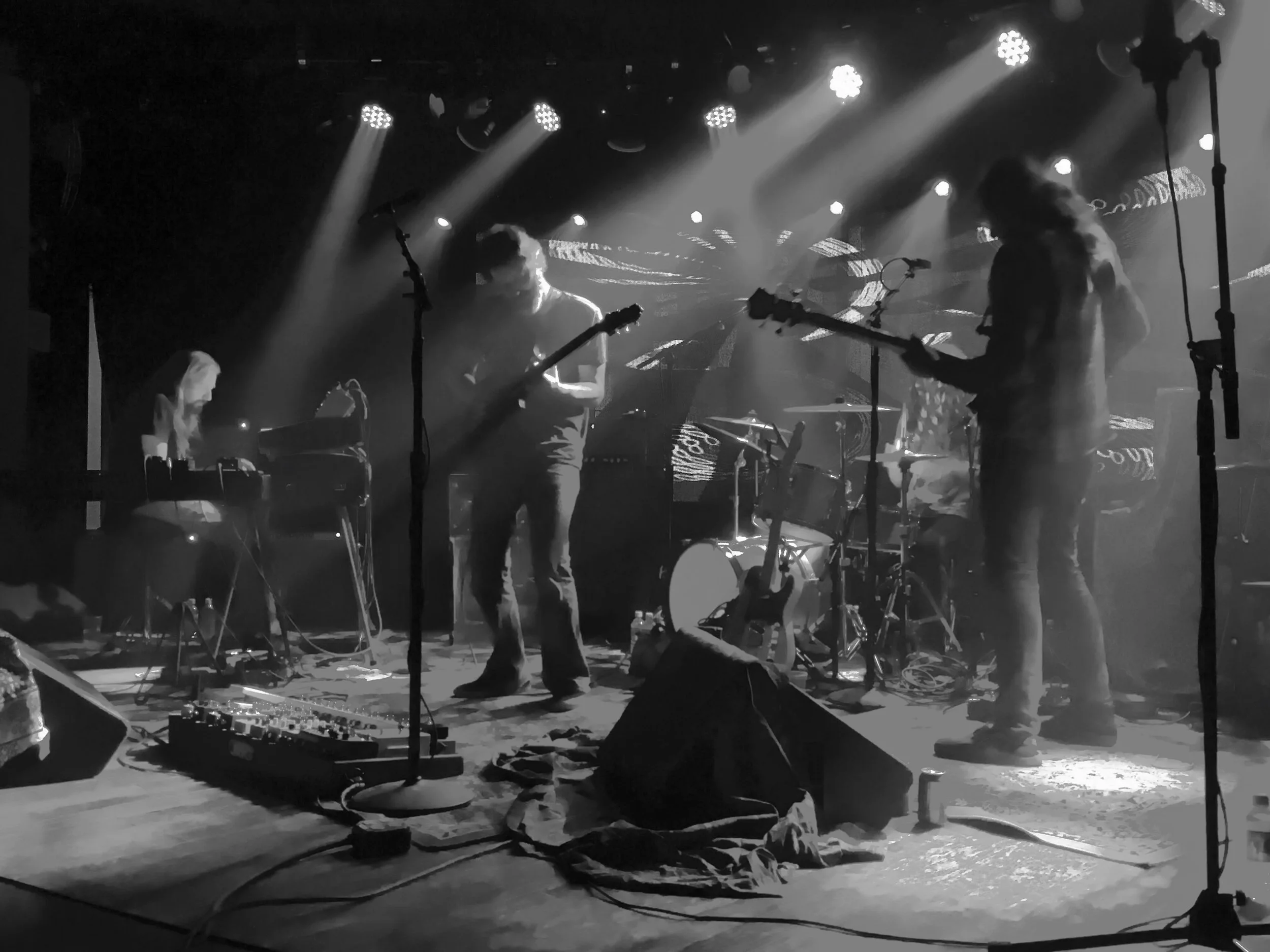 Circles Around the Sun performing at Belly Up Aspen in 2018, black-and-white photo with dramatic overhead stage lighting