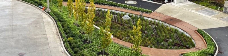 An attractive bioretention system with excellent maintenance access using innovative stormwater distribution channels and a pump station.