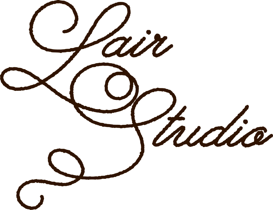 Text that reads 'Lair Studio' in brown cursive script.