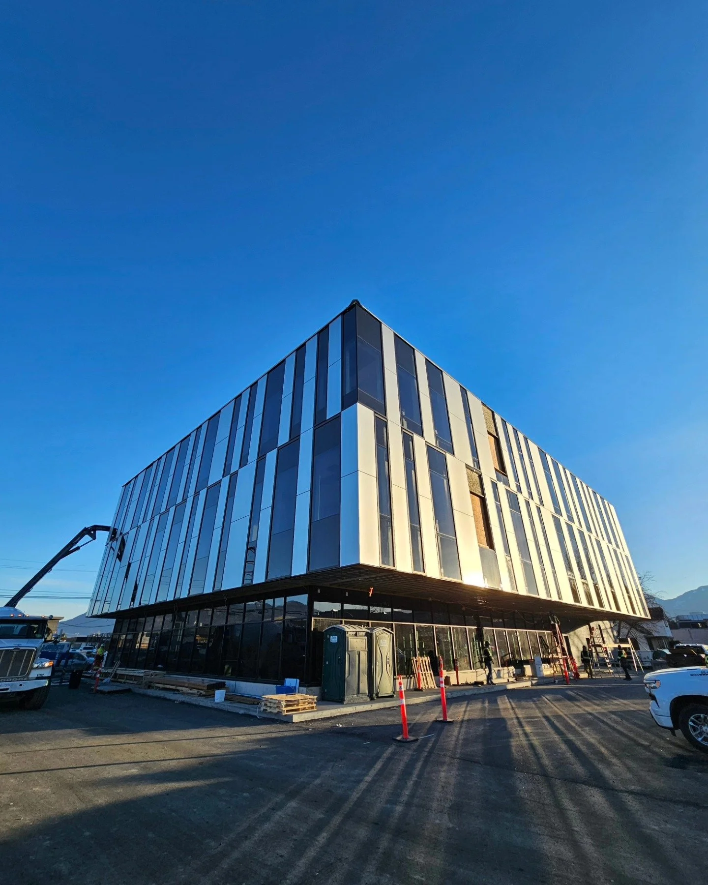 Lots of progress at the new Hocking Office building for @gerryennscontracting! It's a bluebird day, we're painting and hanging wallcoverings, and the concrete crew is happy for a beautiful pour day. Life is good!