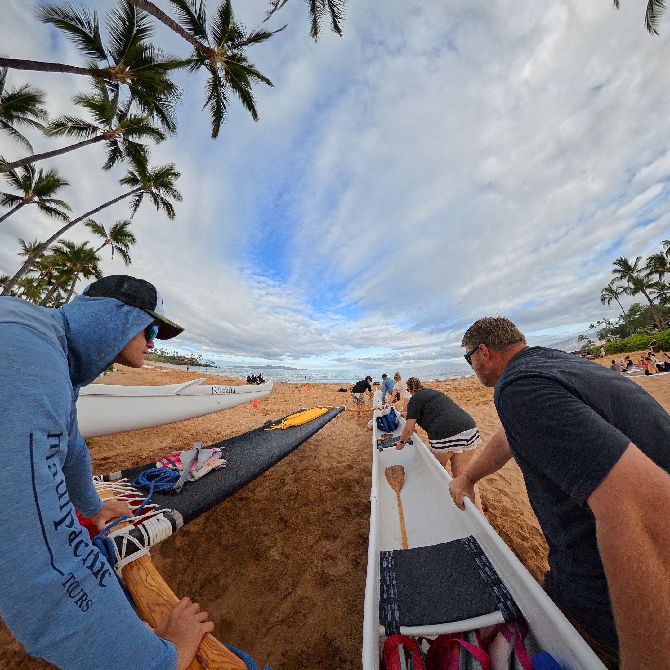 Pushing outrigger canoe