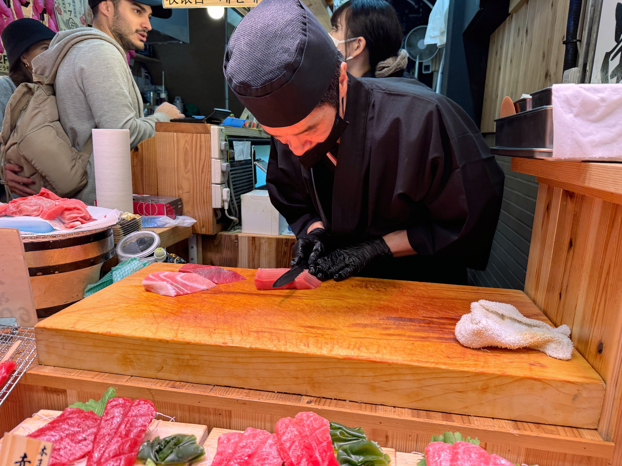 Japanese man cutting raw fish