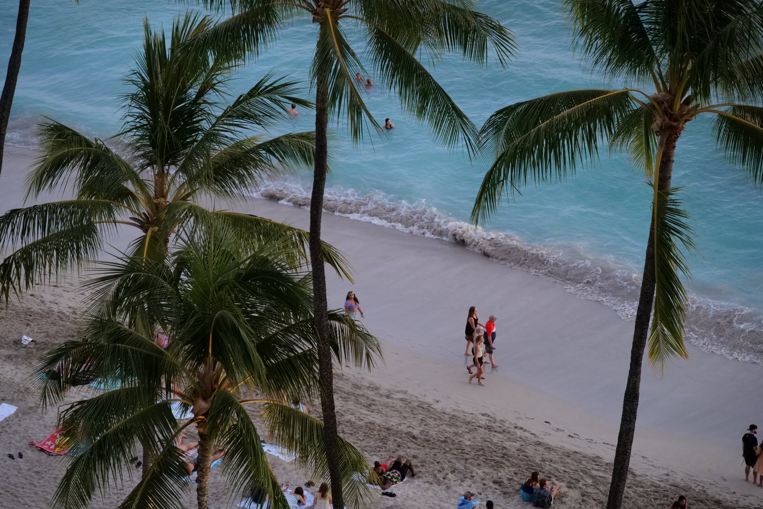 People walking on Waikiki Beach