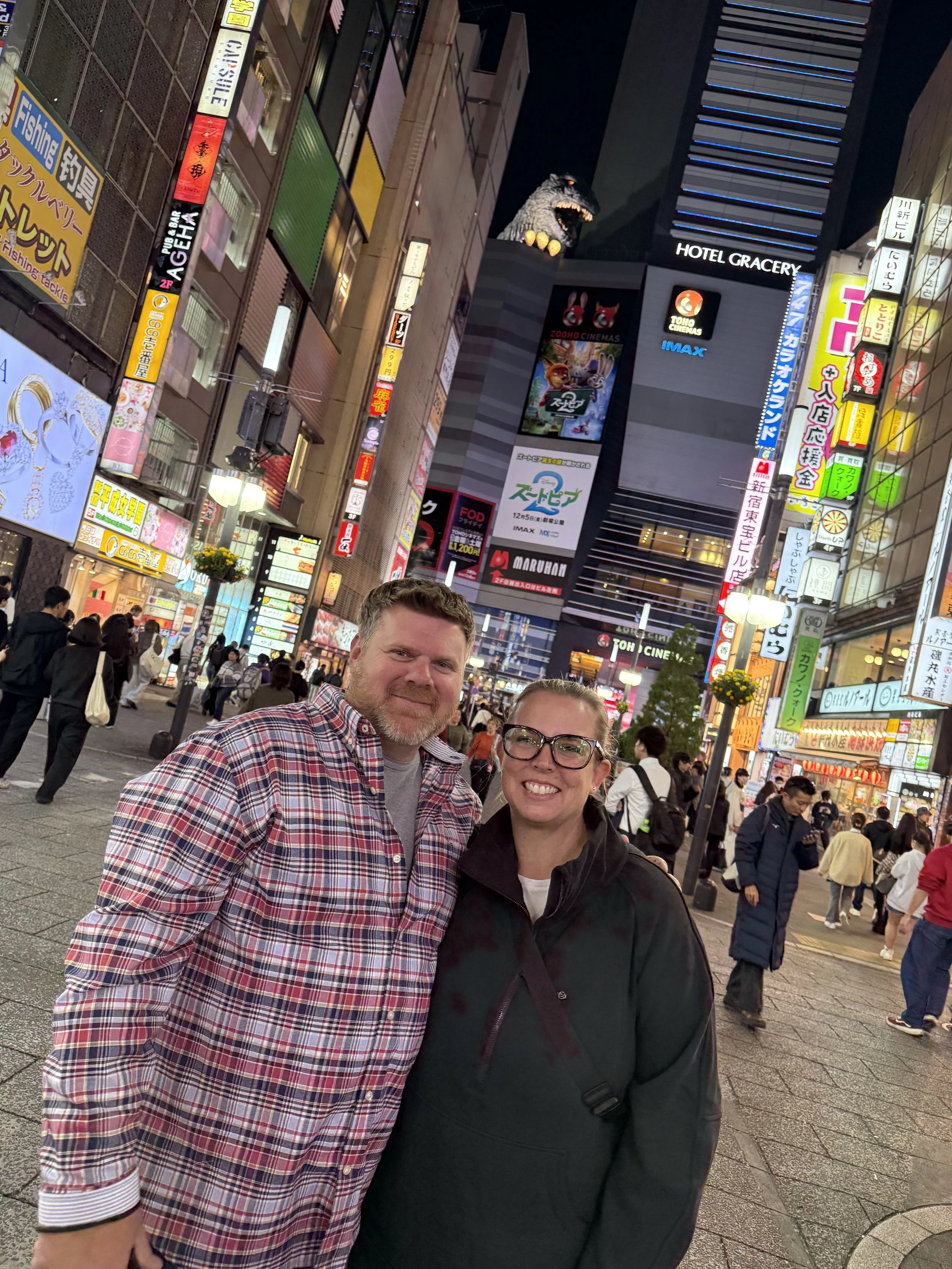 Couple in front of Godzilla