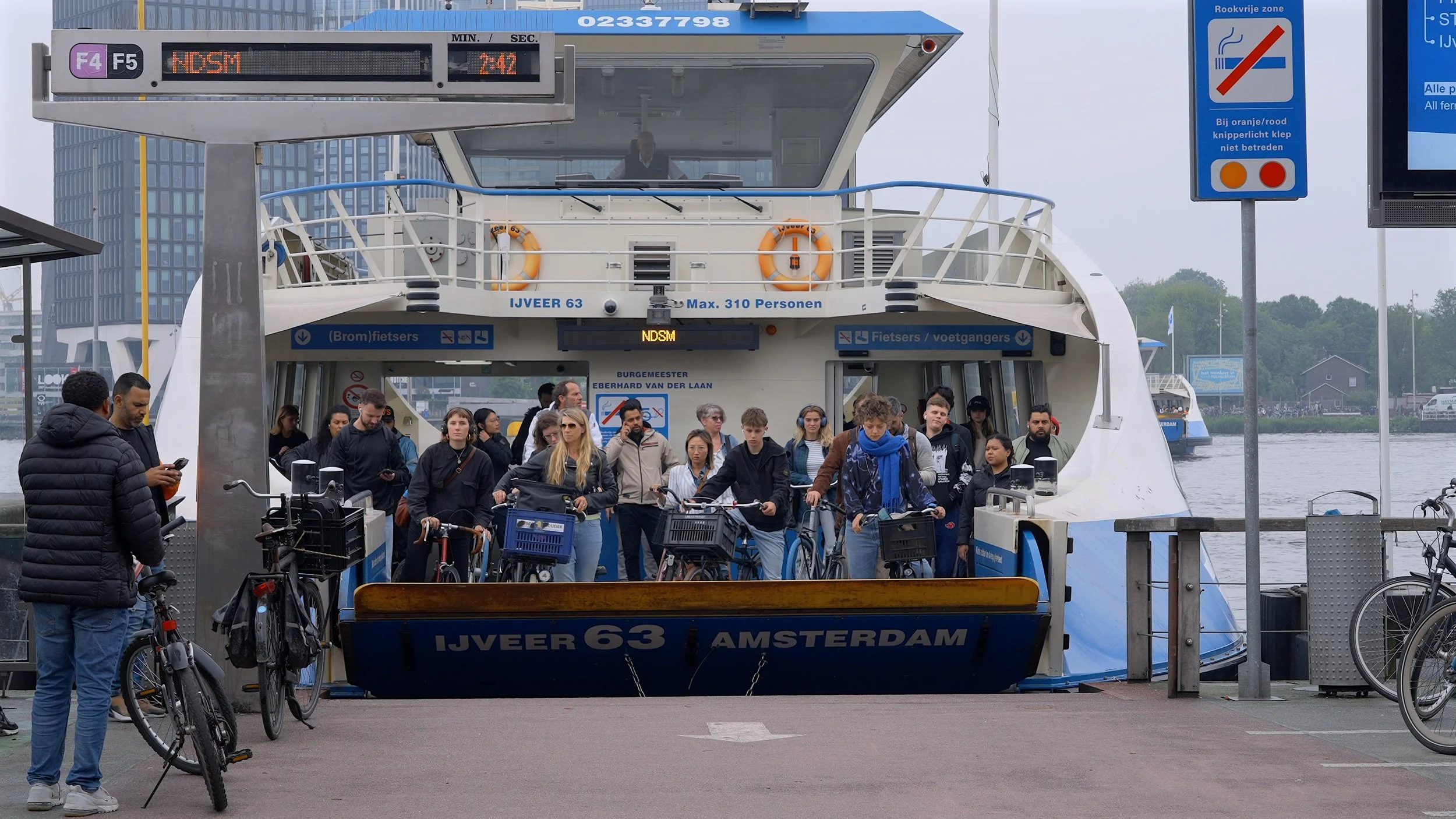 Bike riders getting off ferry Amsterdam
