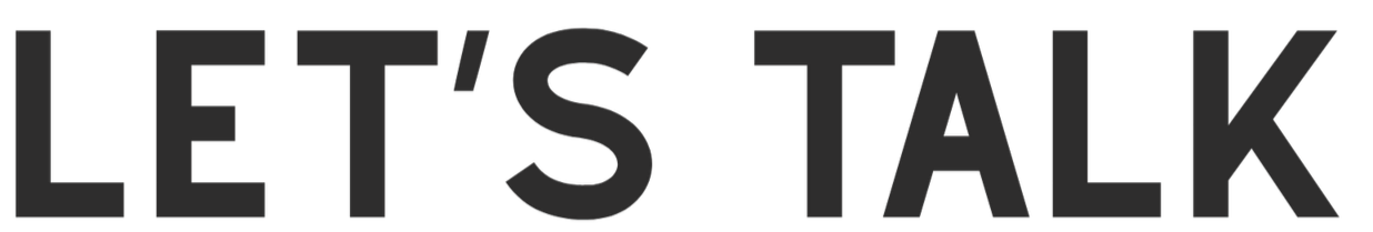 Close-up of black text on a dark background that reads "LET'S TALK."