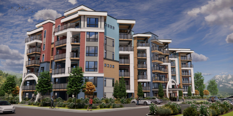 Modern multi-story apartment building with colorful exterior, balconies, and landscaped grounds under a partly cloudy sky.
