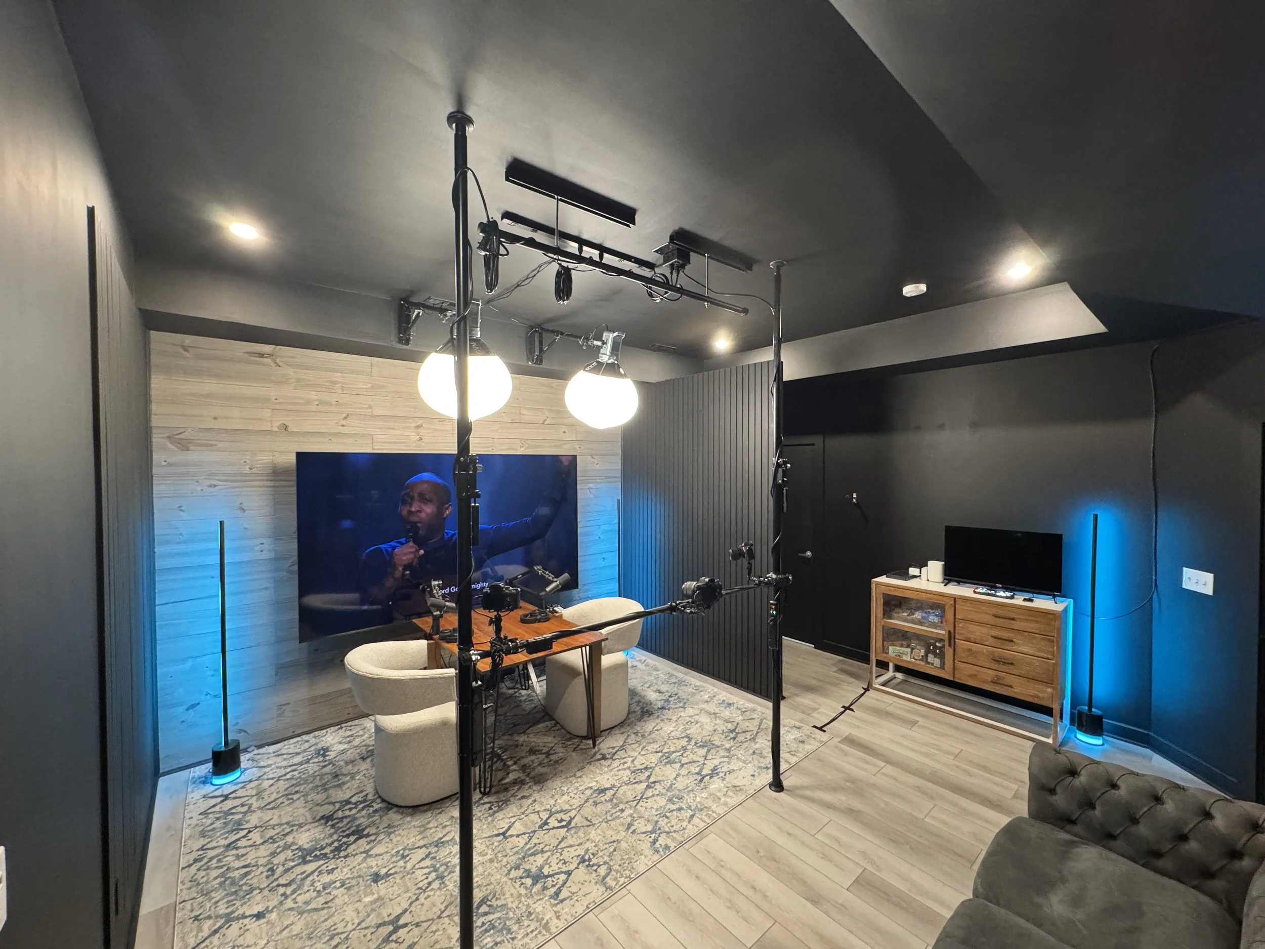 Multi-camera podcast studio with professional lighting and audio equipment