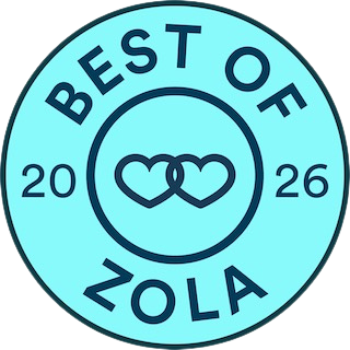 Circular badge with light blue background and black text reading "Best of Zola 2026" with two intertwined hearts in the center.