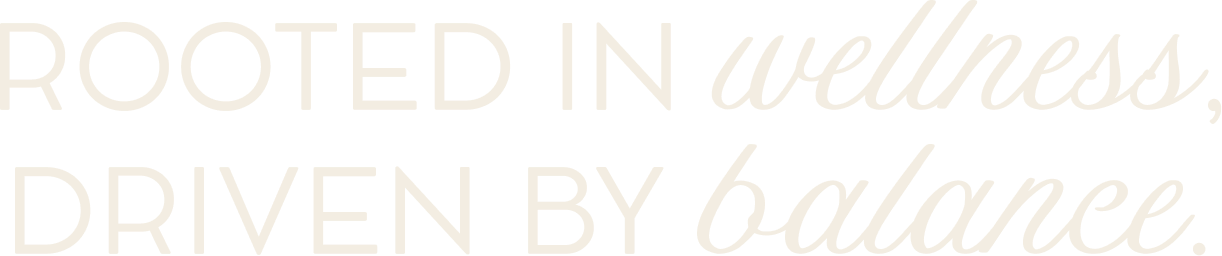 Inspirational quote on a black background: "Rooted in wellness, driven by balance" in white and italicized font.