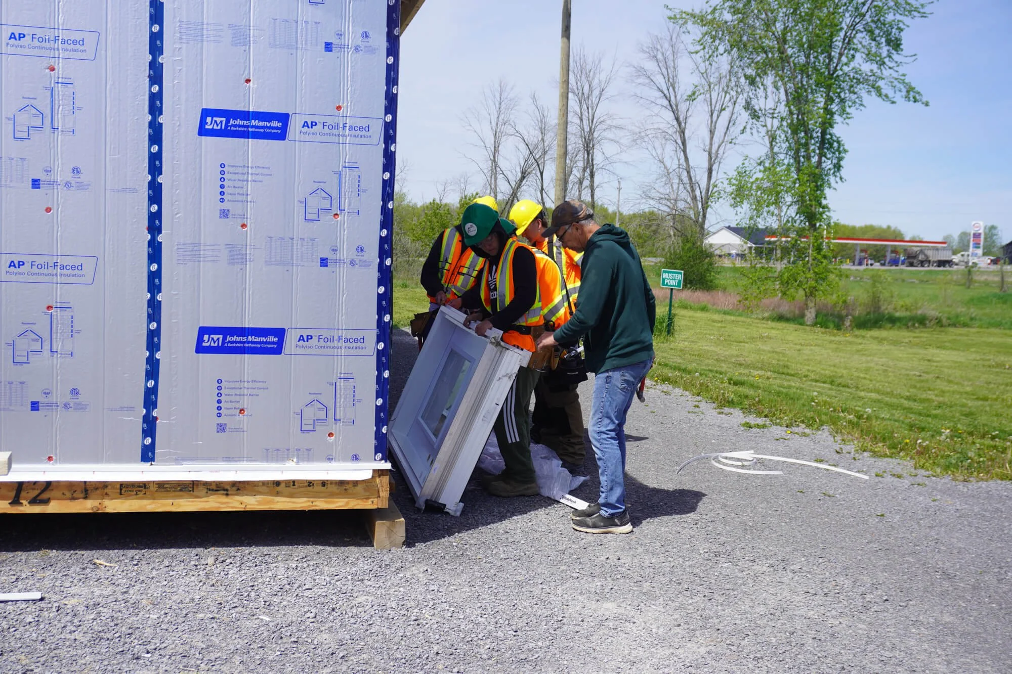 ALFDC carpentry trainees building a prefabricated house during an Indigenous pre-apprenticeship program in Ontario.