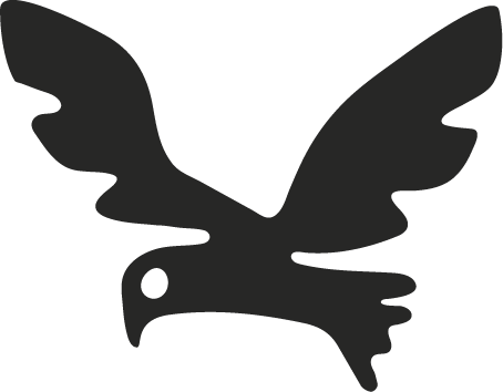 Silhouette of a flying eagle with outstretched wings.