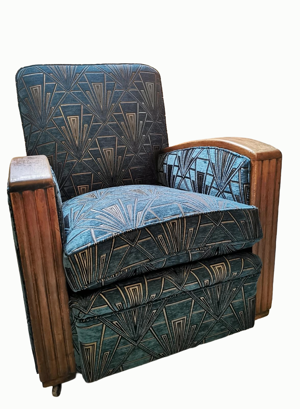 Vintage armchair with blue geometric upholstery and wooden armrests.