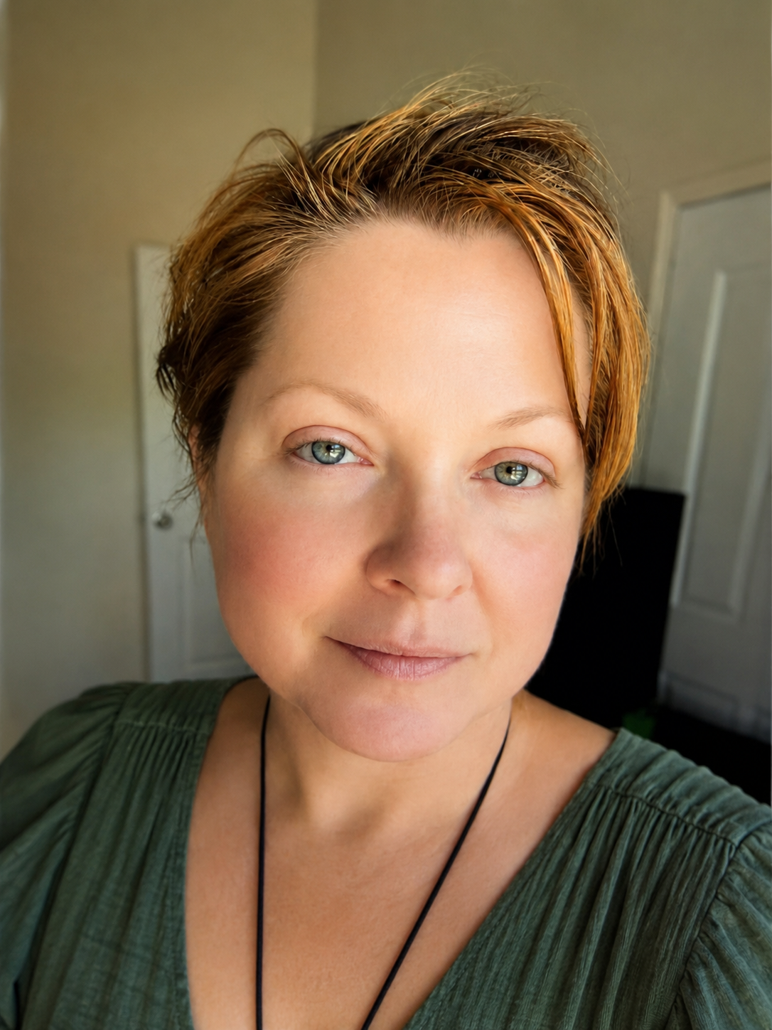 Portrait of Stacy Simms, founder of Aven Hollow and trauma-informed holistic healing practitioner.