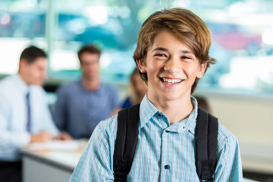 smiling boy with backpack