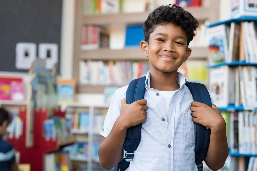 a confident smiling kid