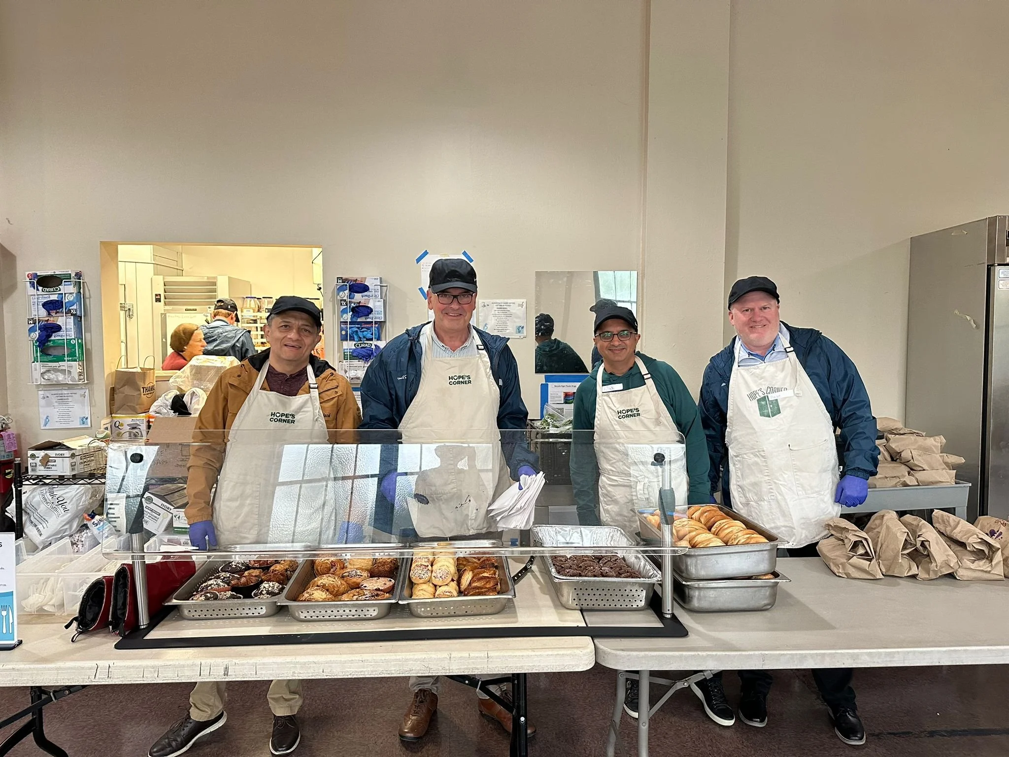 Volunteers serving pasteries.jpeg