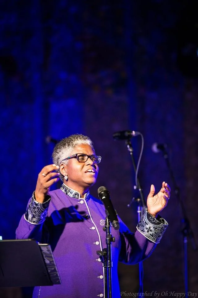 Karen Burke, artistic director, leading Toronto Mass Choir singers during a gospel choir performance