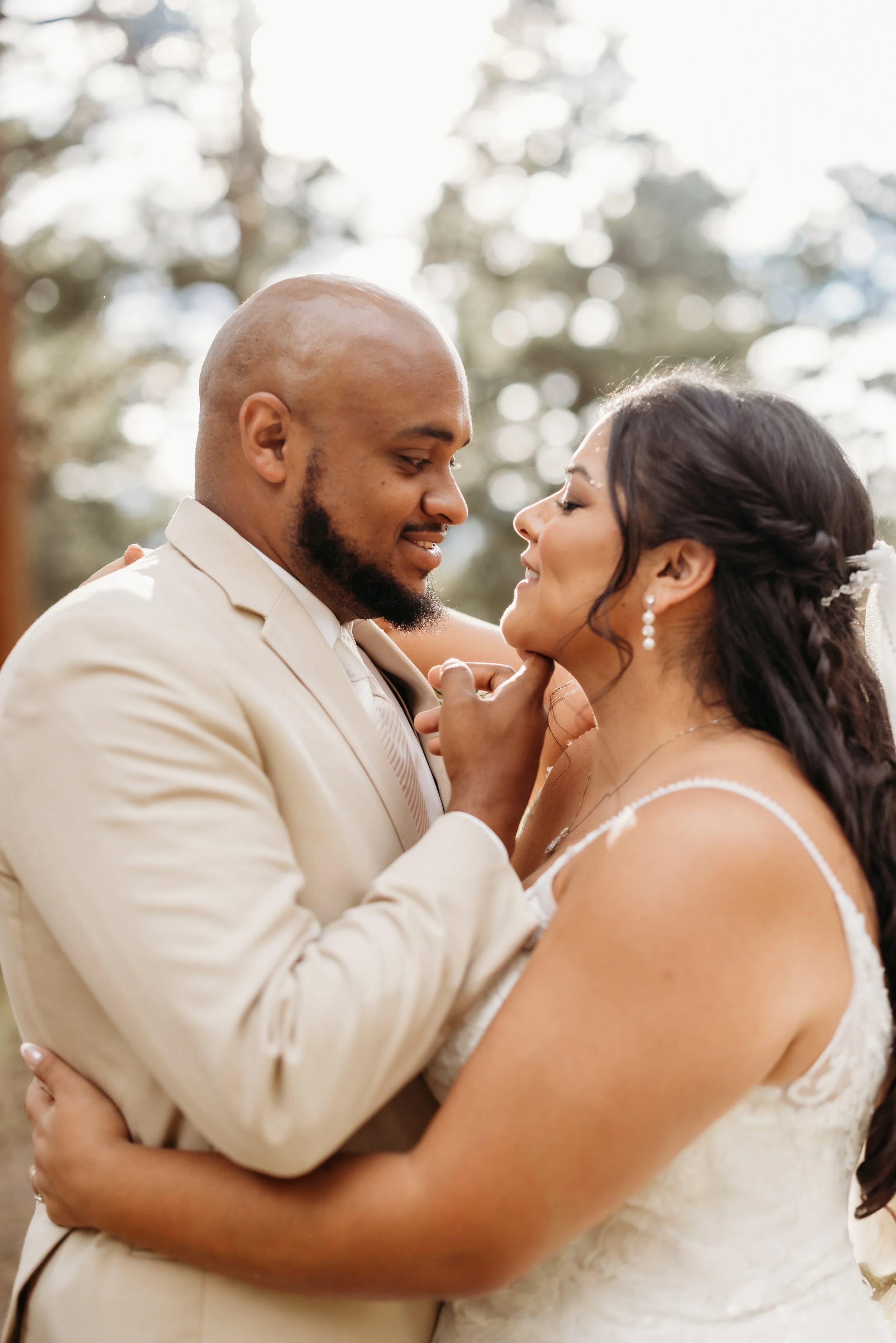 Bride and groom embracing.