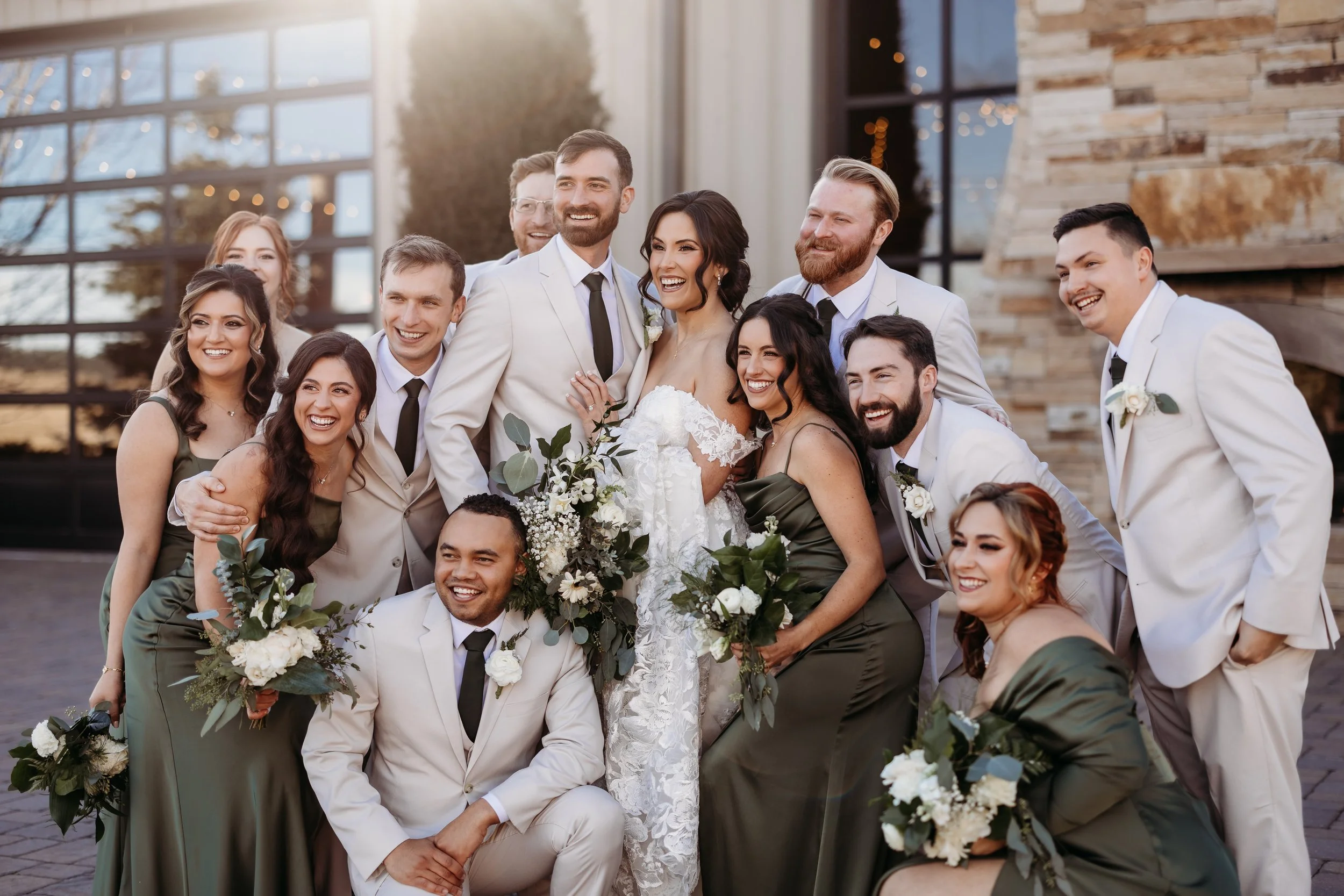 Bride and groom celebrating with their wedding party at Spruce Mountain Ranch.