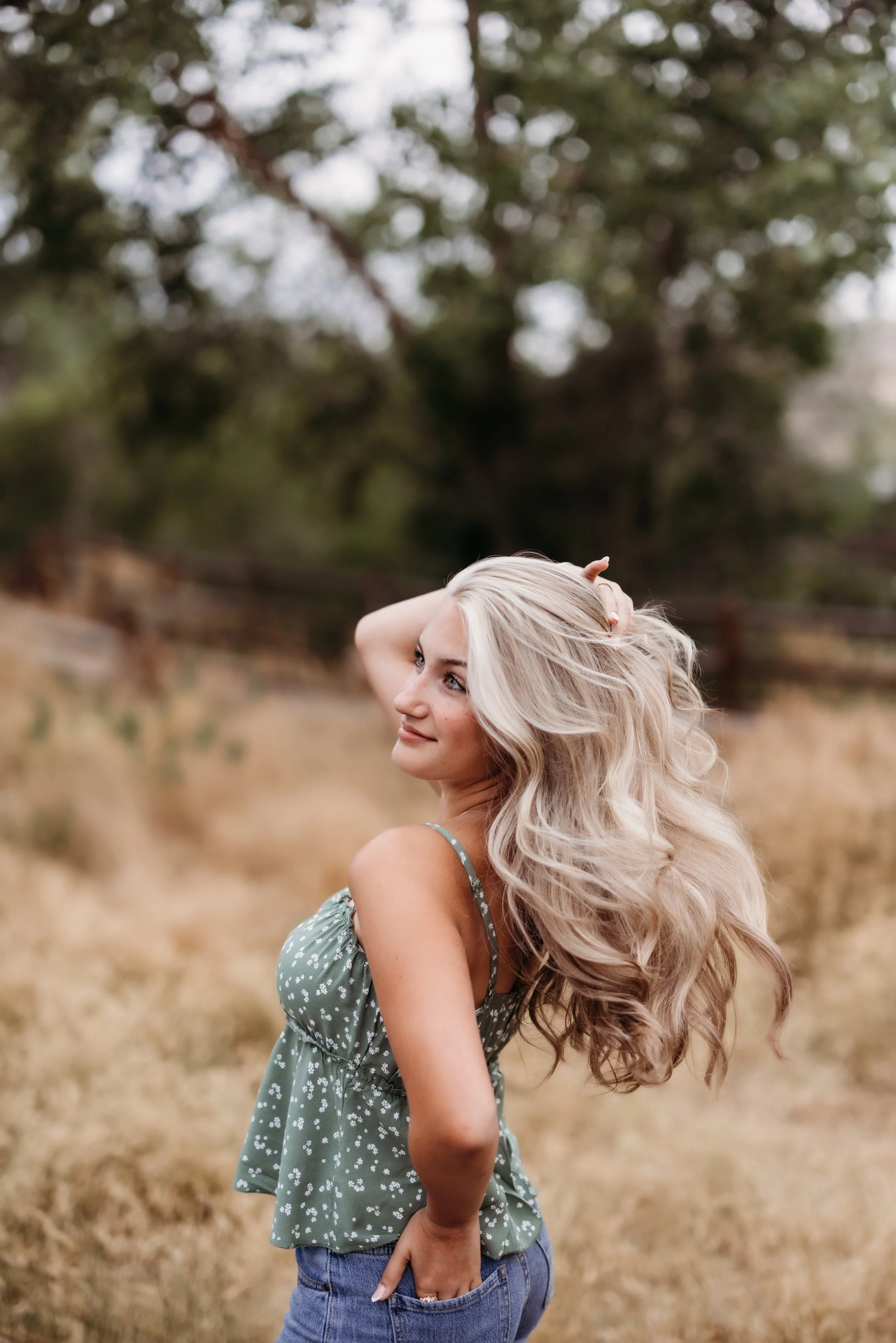Senior girl playing with her hair.