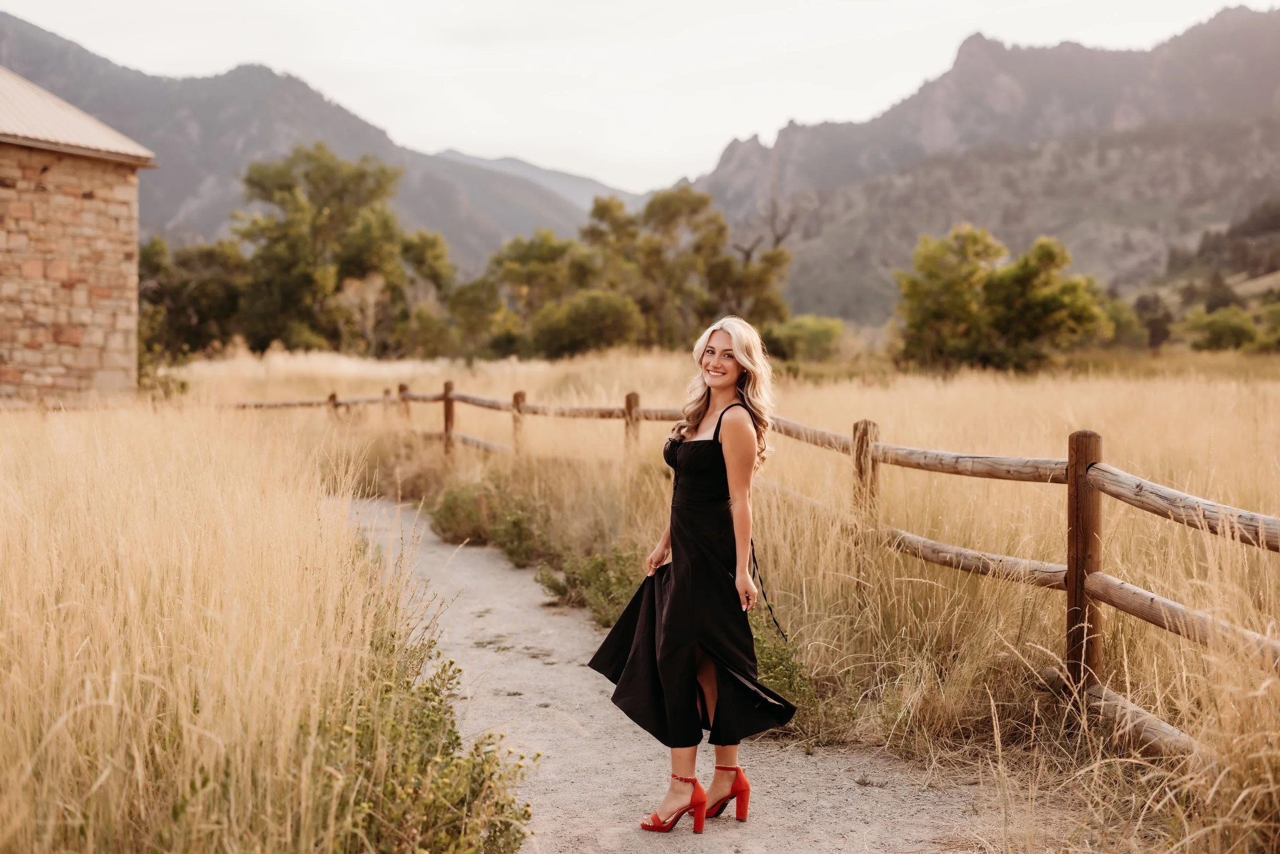 Girl in a black dress spinning around.