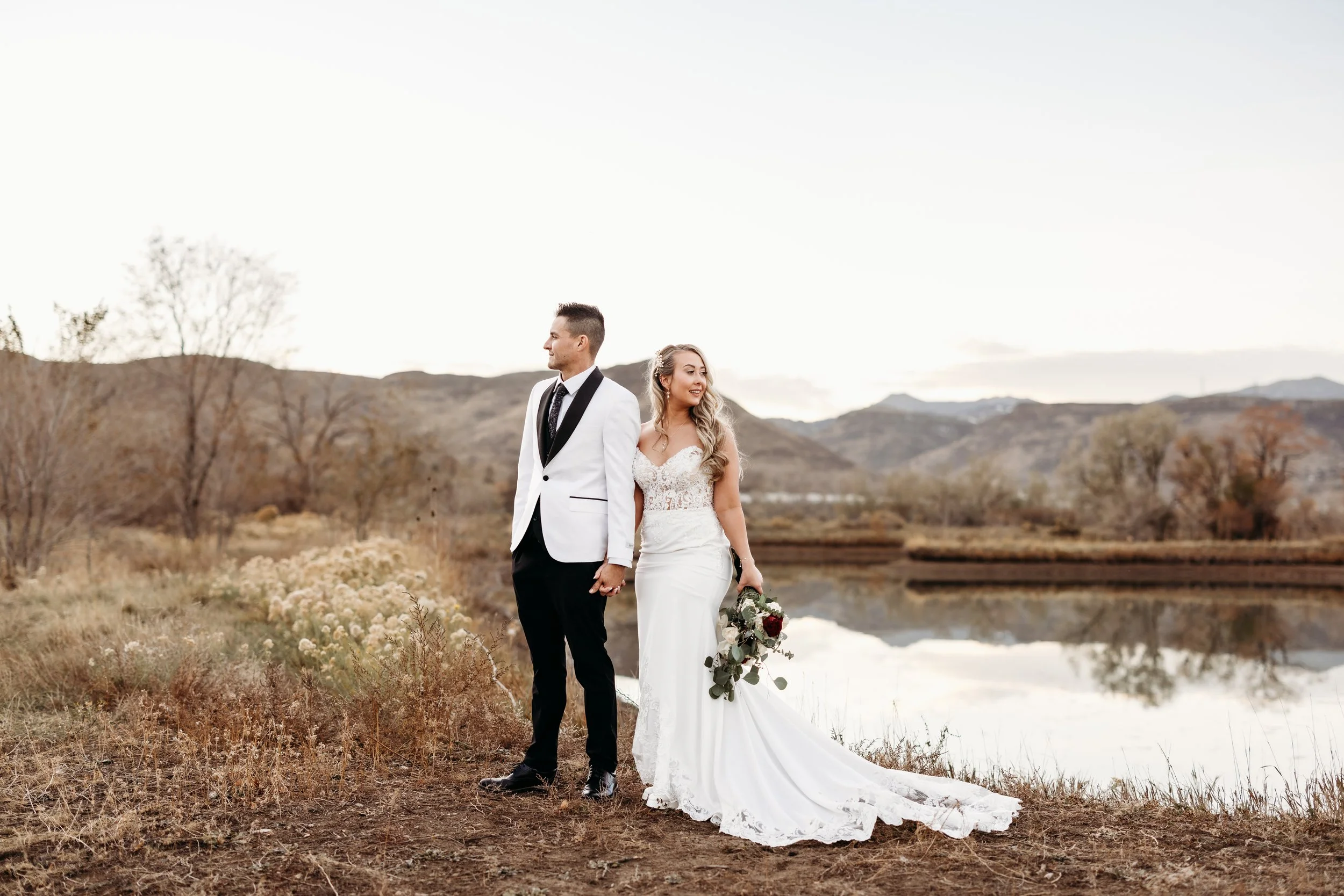 Bride and groom posing at Applewood Golf Course.