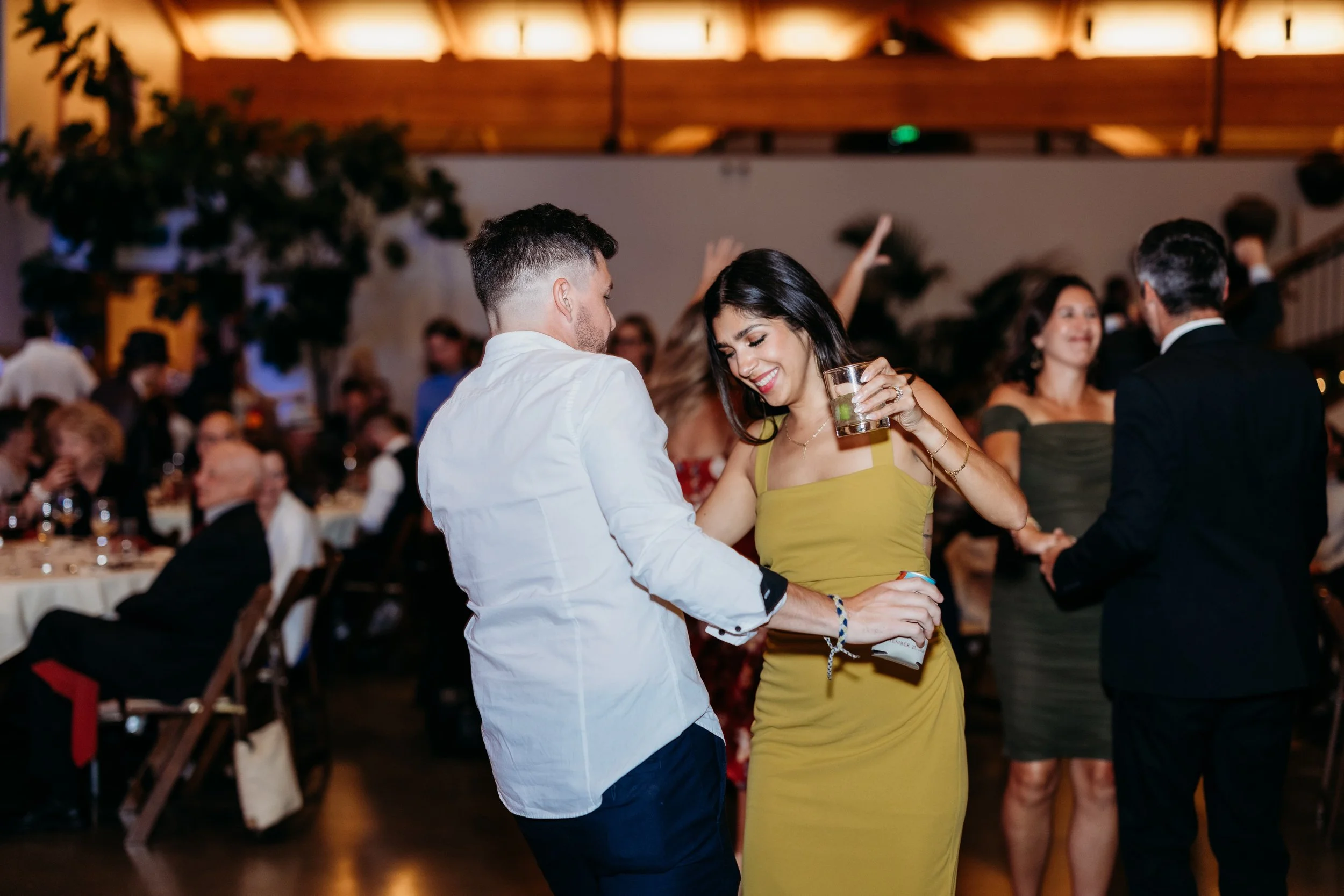 Man and woman dancing at a wedding reception.