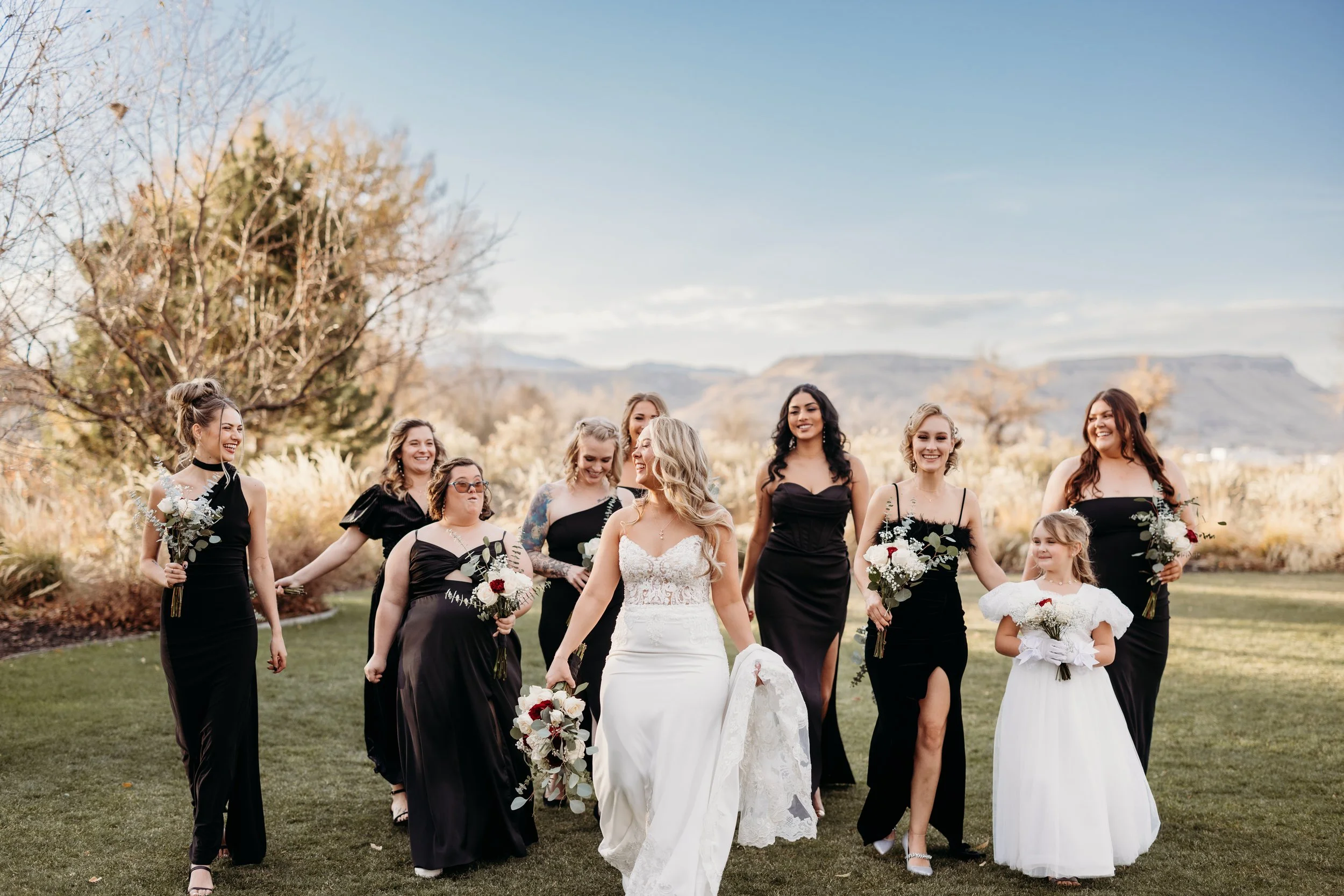 Bride walking with her bridesmaids and flower girl at Applewood Golf Course.