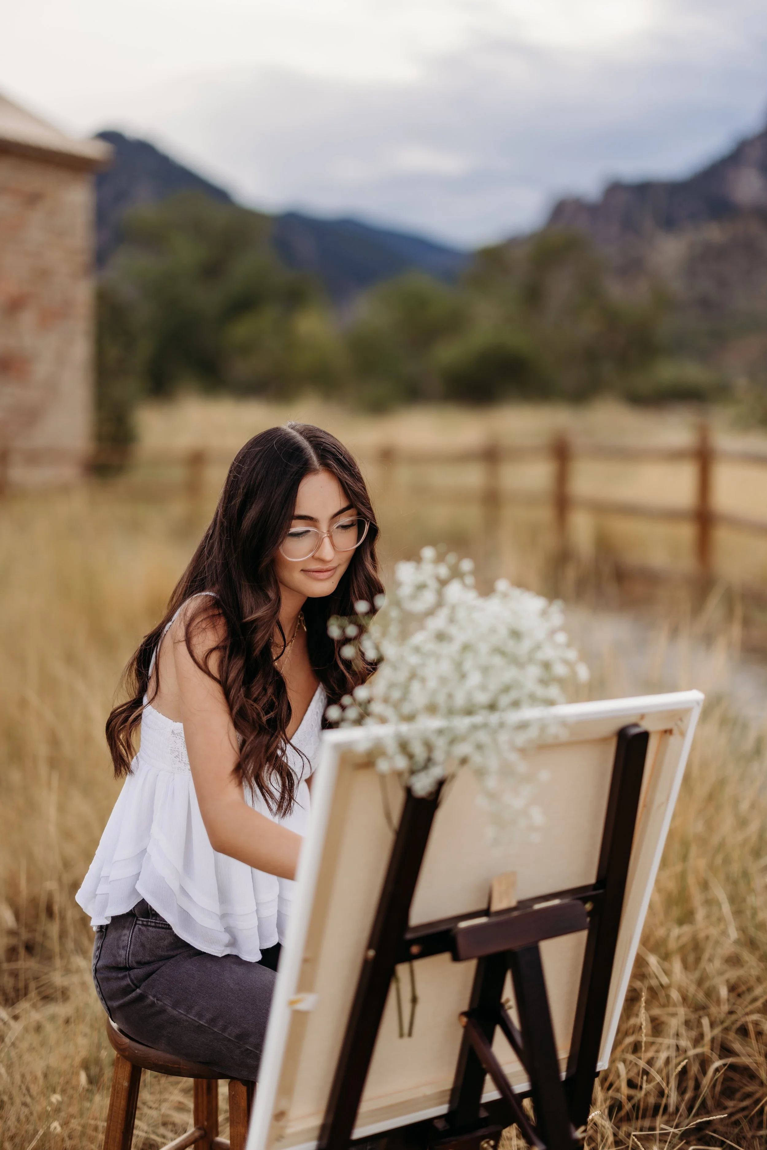 Teenage girl painting on a canvas in Boulder, Colorado.