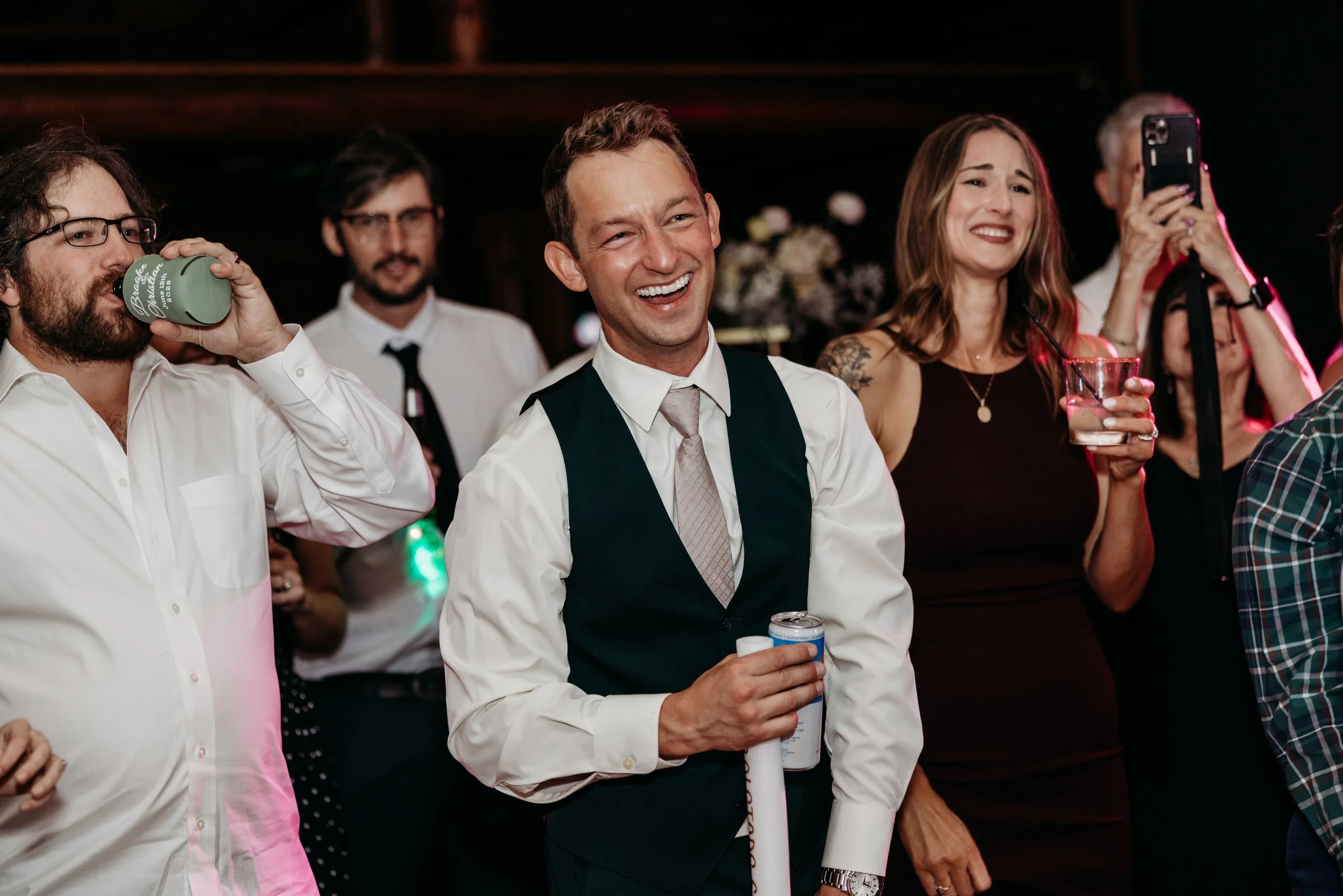 Groom smiling during the wedding reception.