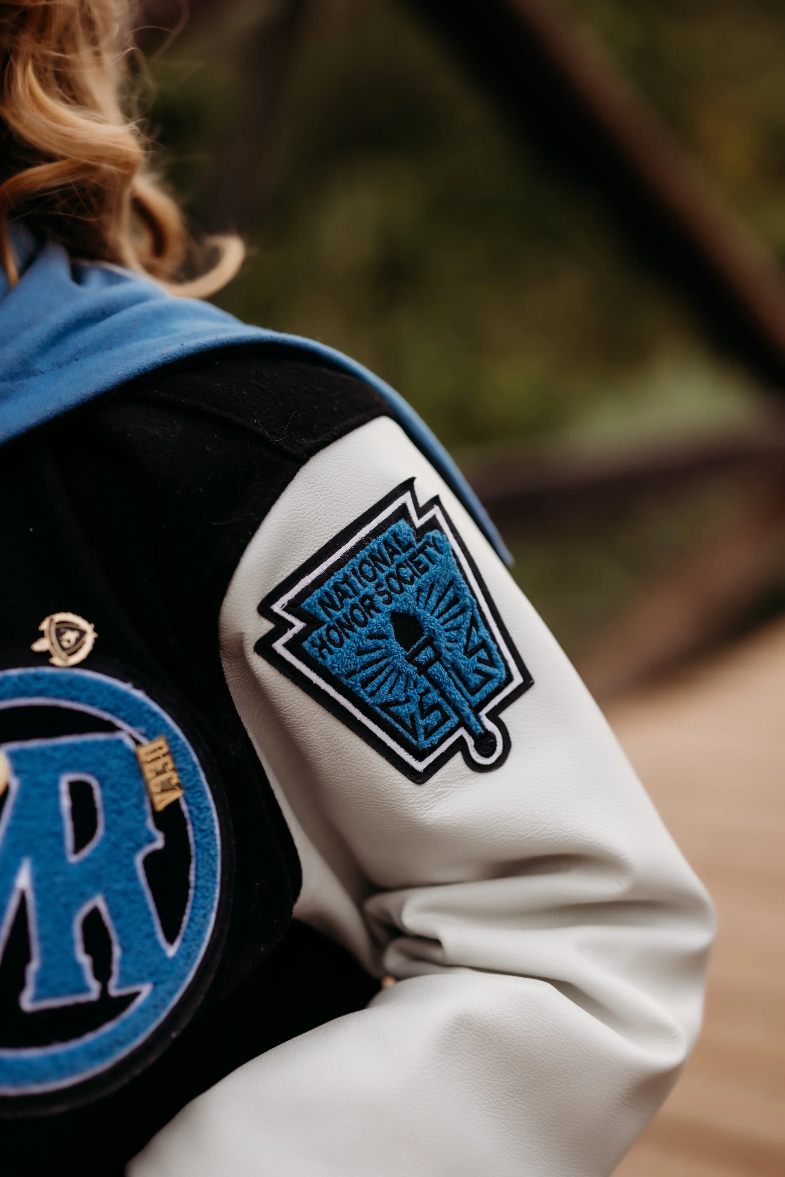 Honor society patch on a Mountain Range High School letterman's jacket.