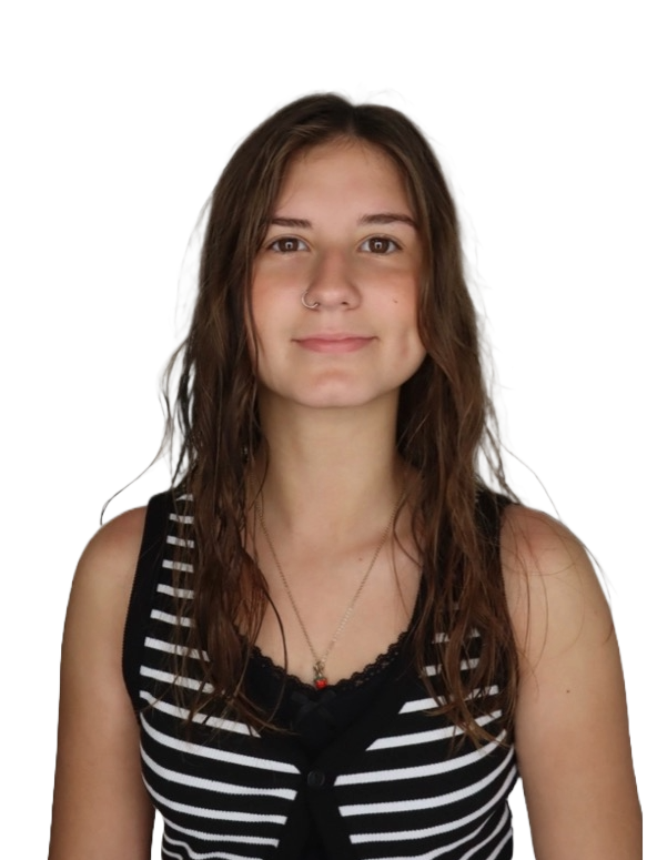 Young woman with long brown hair, wearing a black and white striped sleeveless top and a necklace with a small pendant, smiling at the camera.