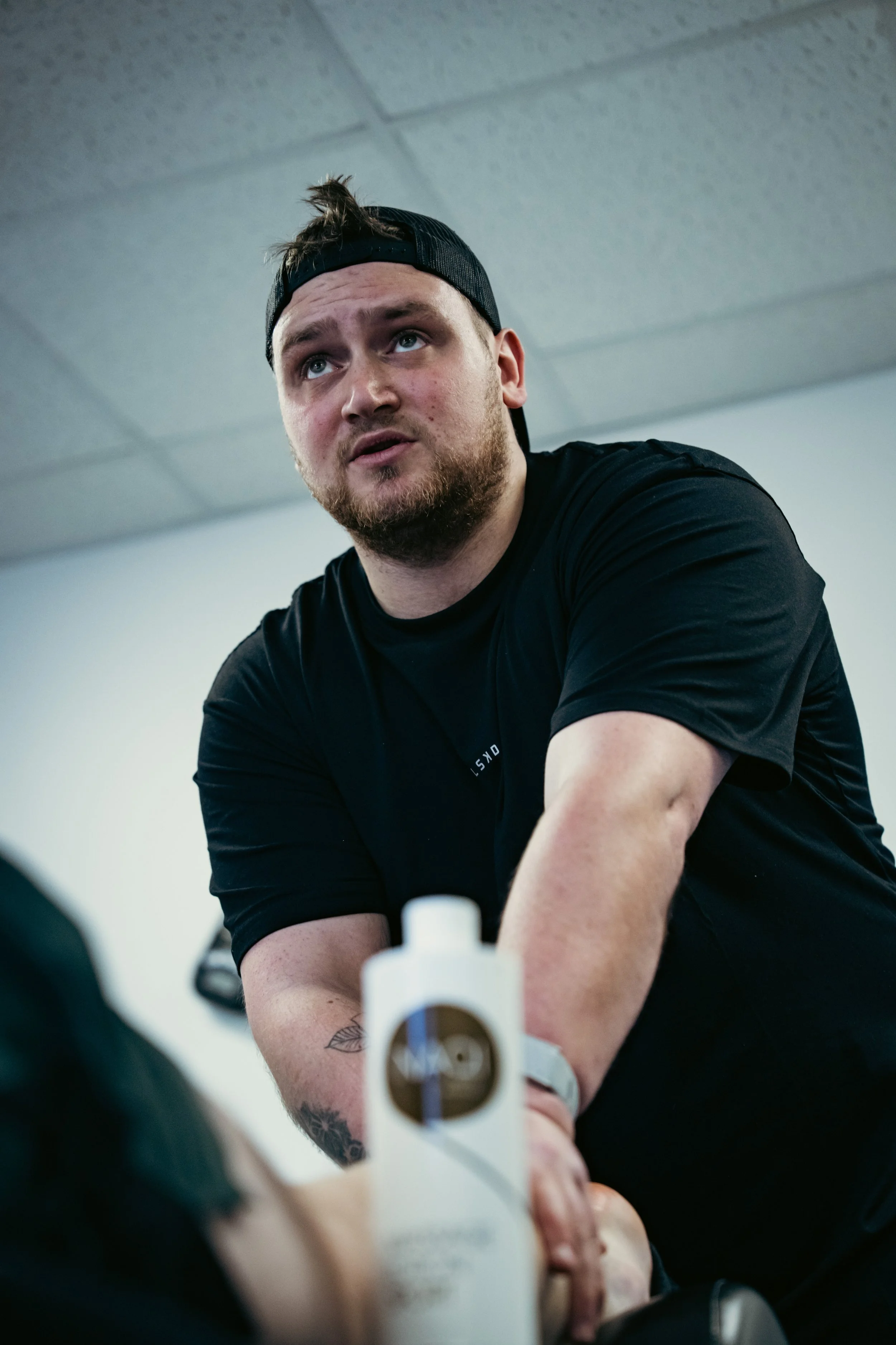 Sports massage therapist providing hands-on treatment to an active client in Winchester.